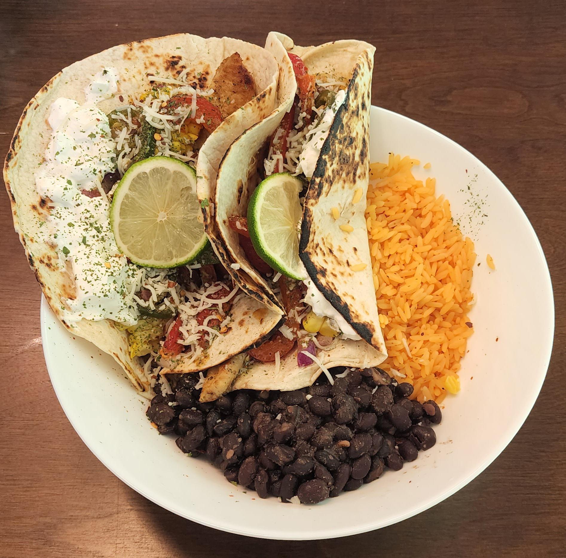 Swai fish tacos, yellow rice, and black beans. r/tonightsdinner