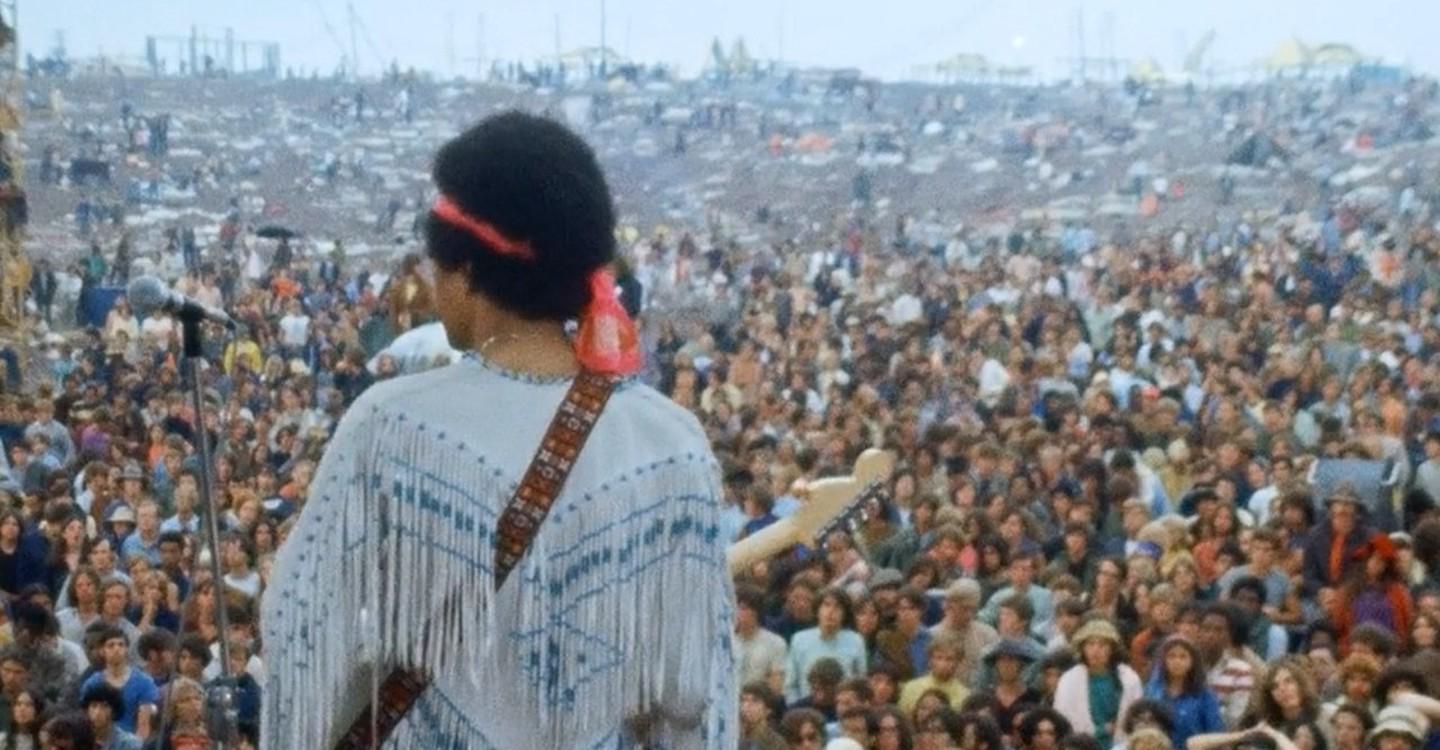 Jimi Hendrix playing to the Woodstock crowd, 1969. r/OldSchoolCool