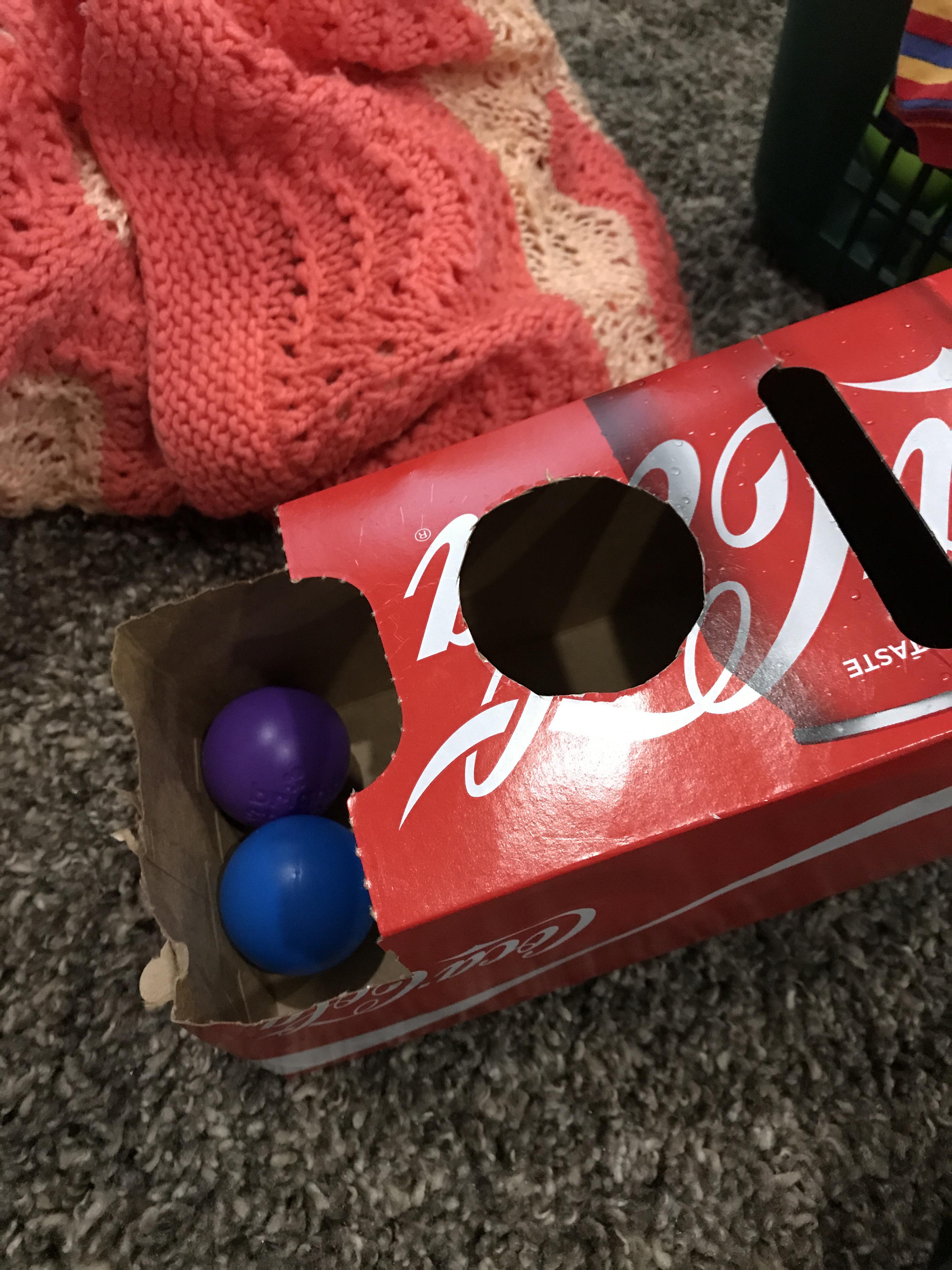 DIY ball drop toy using a cola box (rather than shoe box less cutting