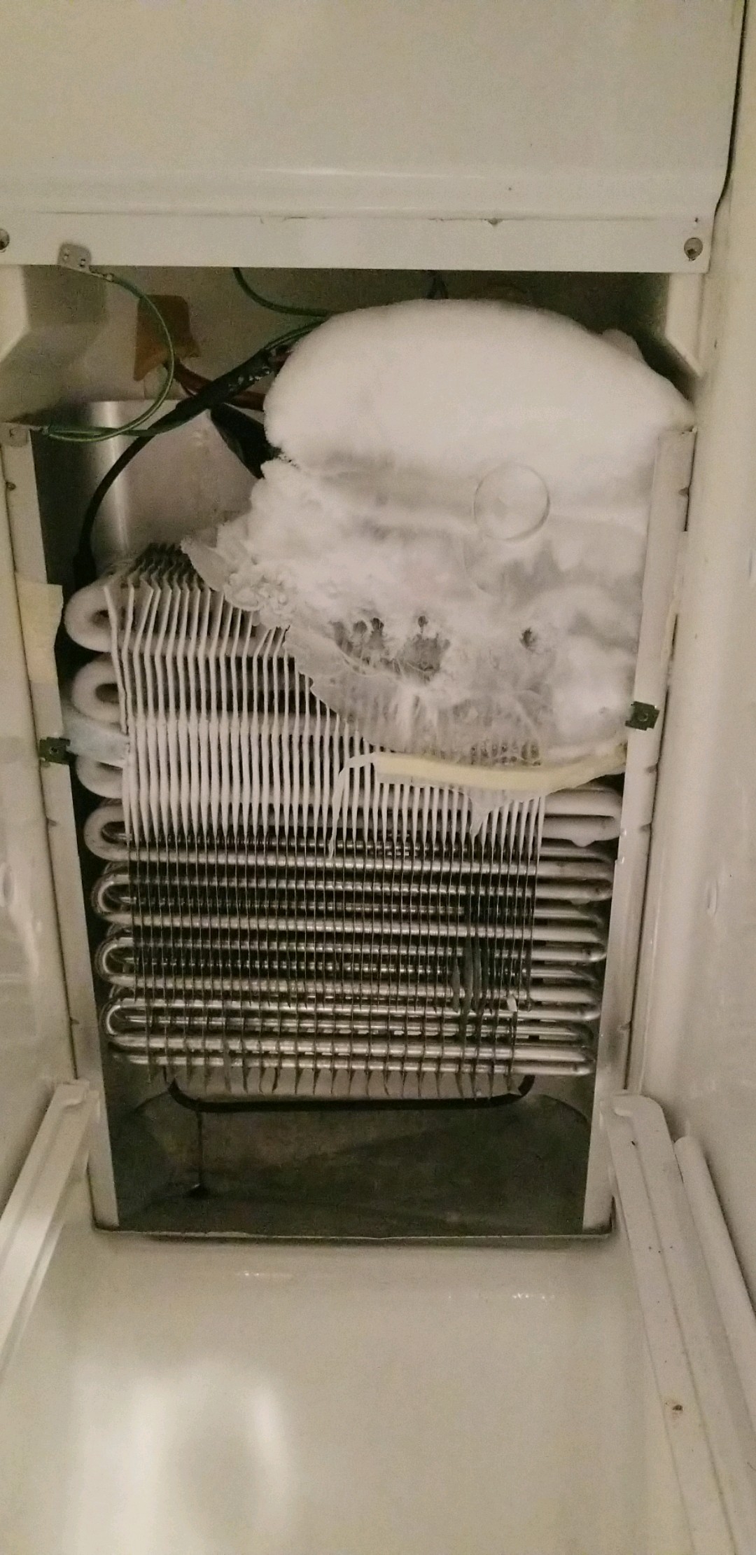 Freezer cooler freezing over. Leaking water onto floor. r/fixit