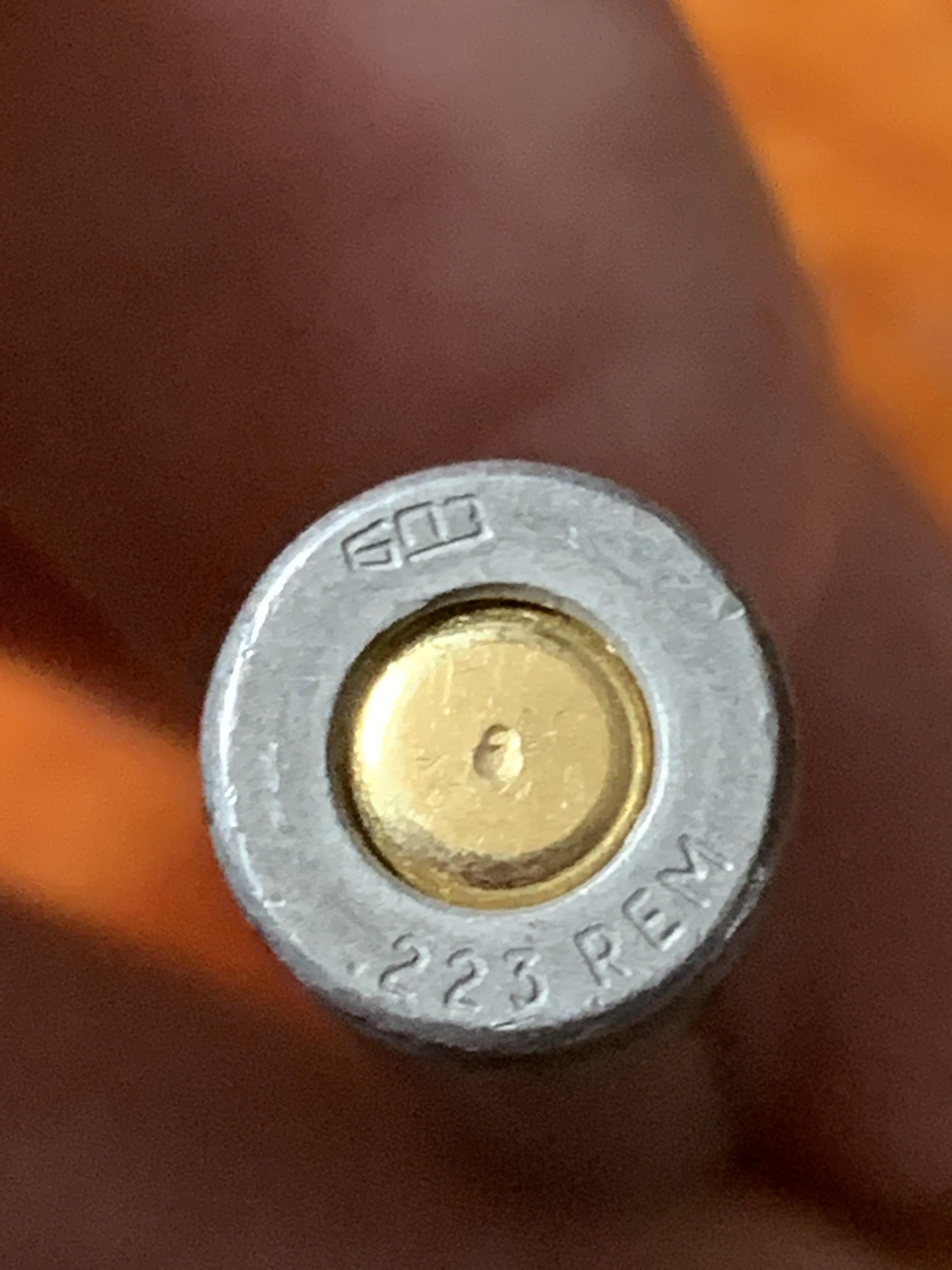 When I release the bolt on my AR the firing pin is putting little dimples in the primers, is