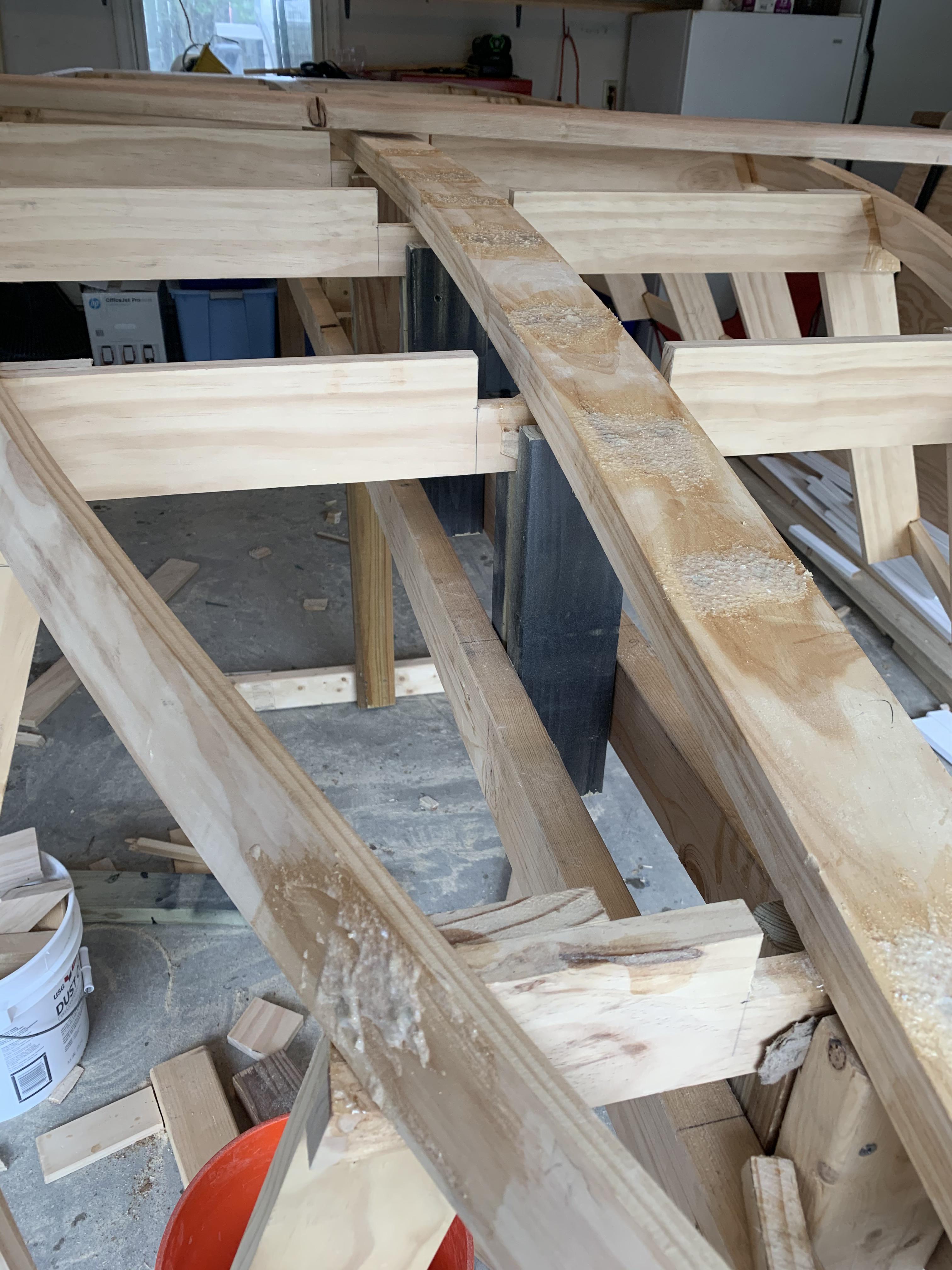 Screw holes filled with epoxy/sawdust mix. Fairing boat and putting