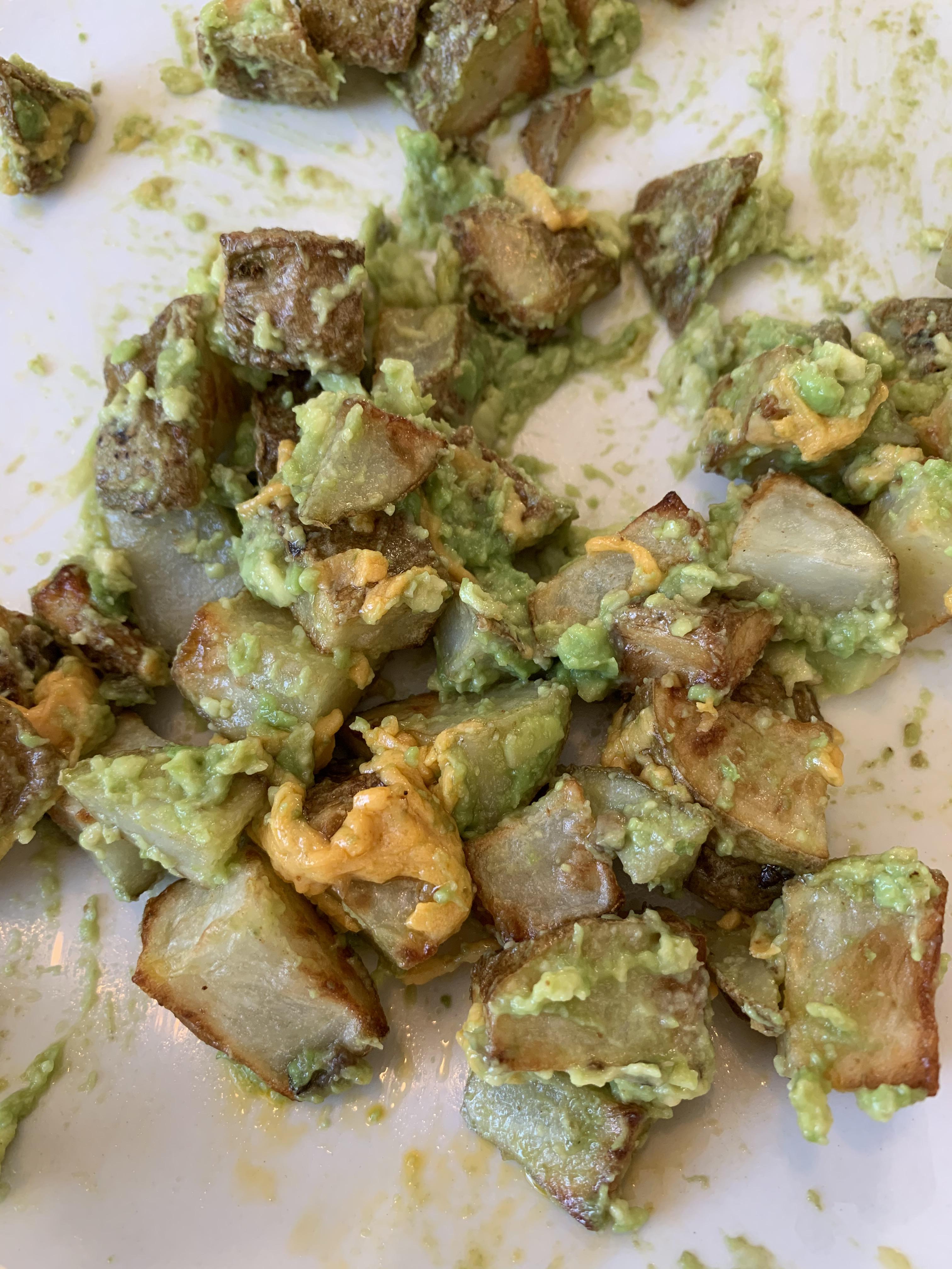 Air fried potatoes with mashed avocado and melted Daiya cheddar