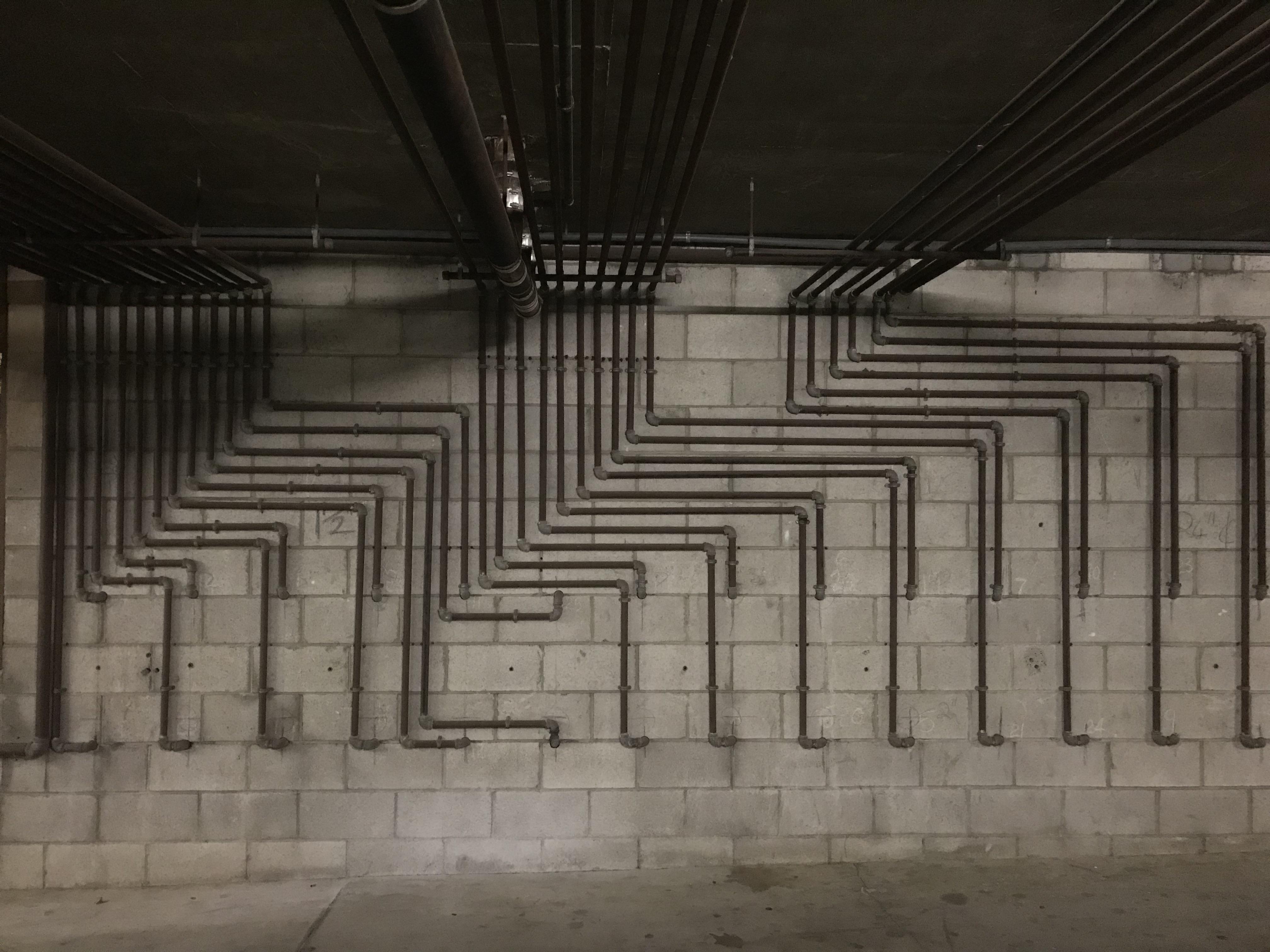 These pipes in a parking garage. r/oddlysatisfying