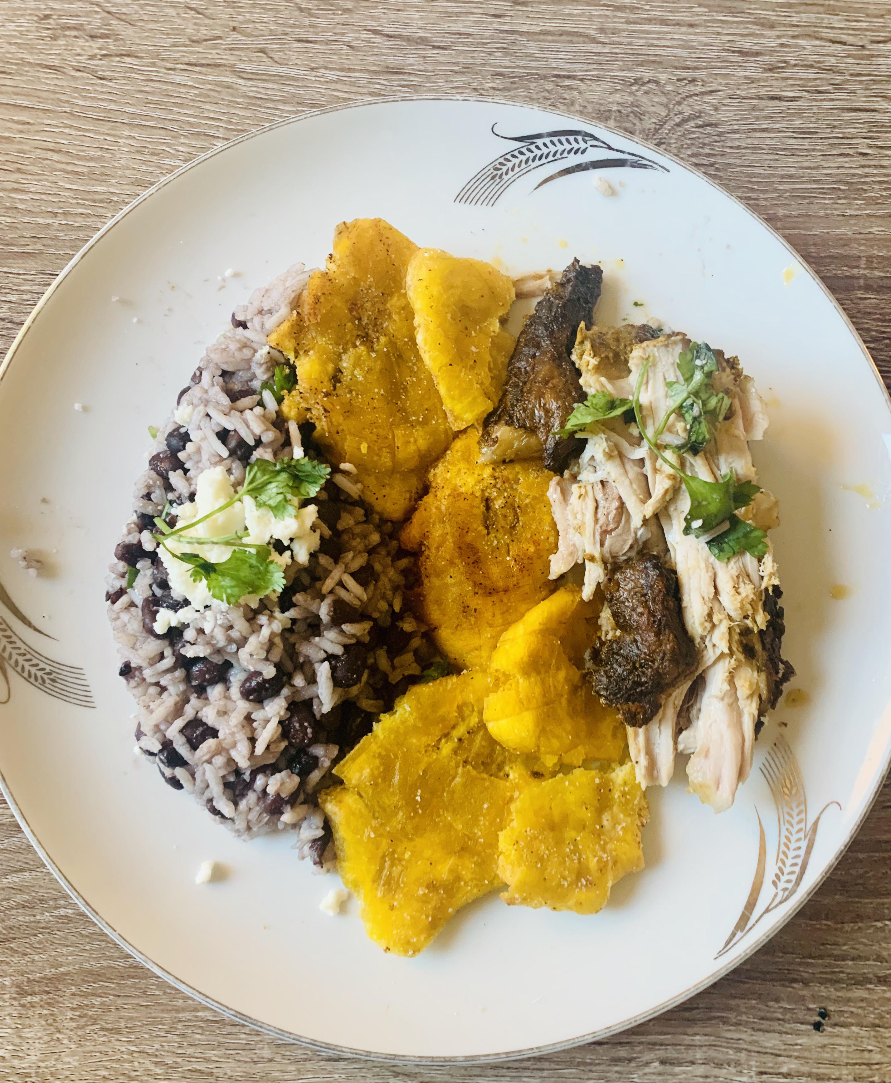 Puerto Rican Pernil (slow roasted pork shoulder)Arroz Congri ( Cuban