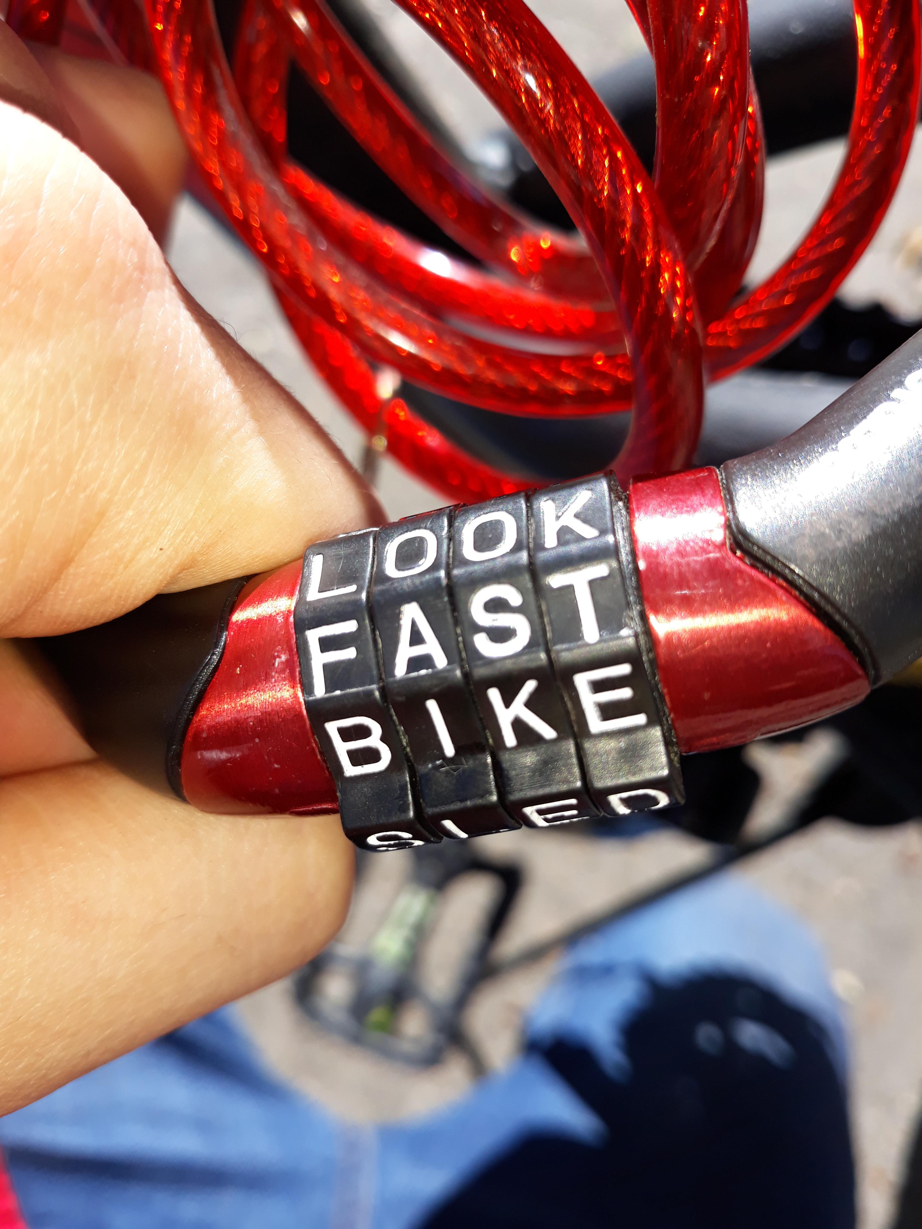 If you line up the raised parts of my bike lock it says "look fast bike