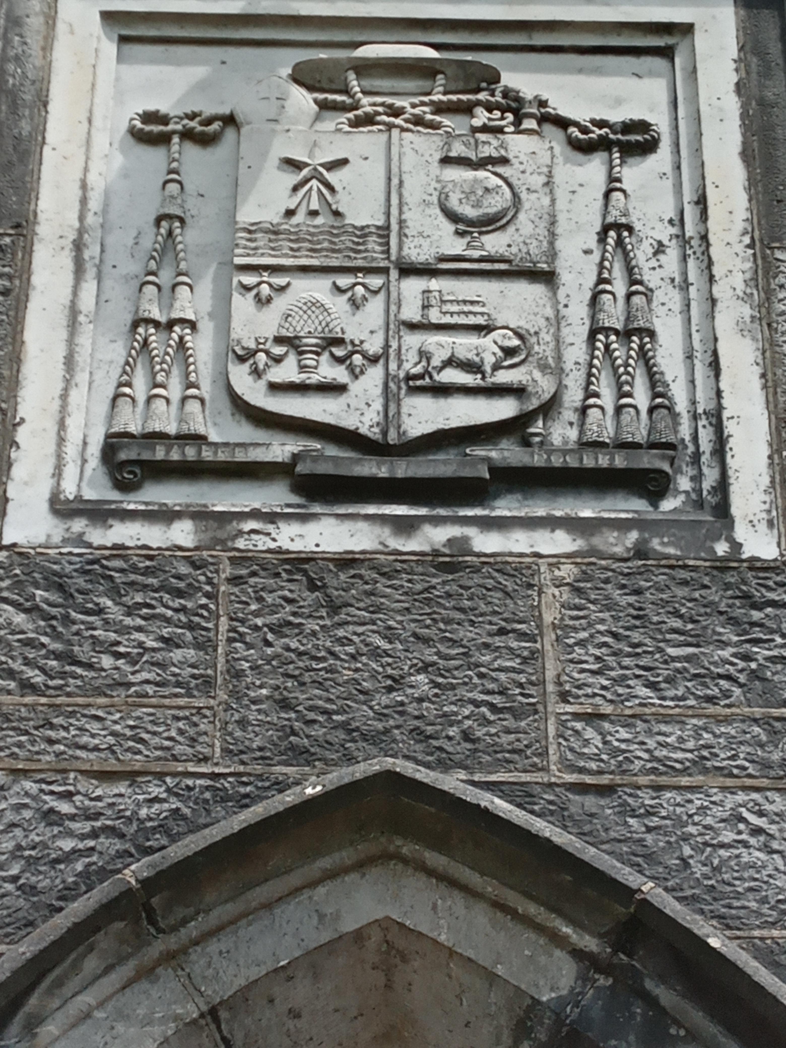 can anyone explain the symbols on this coat of arms found above the
