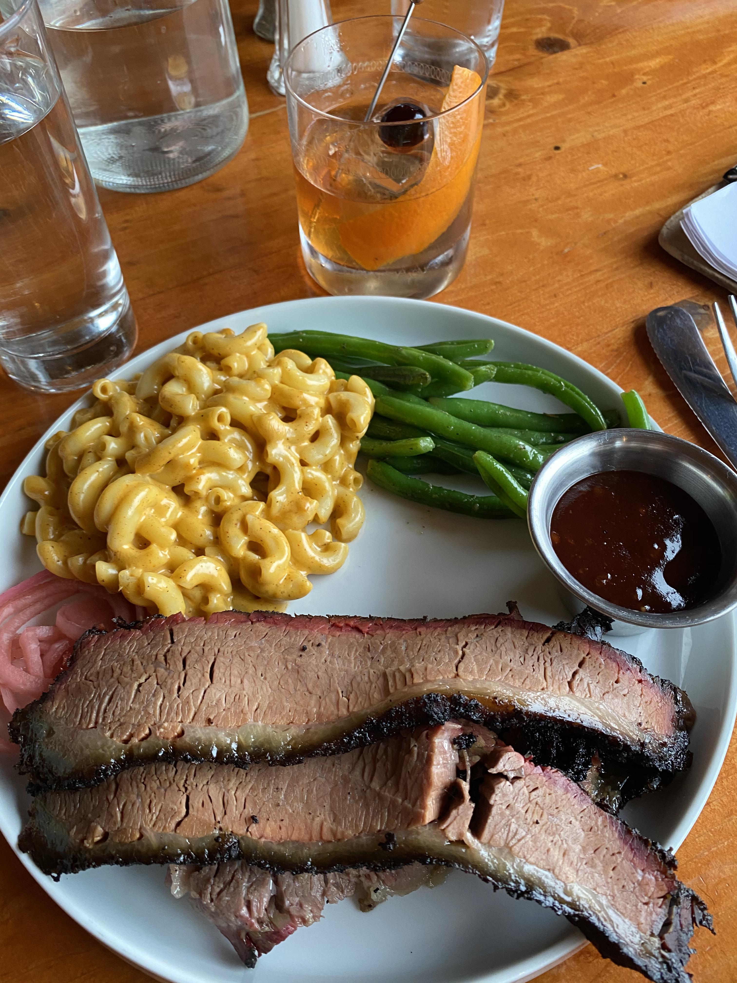 [I ate] hardwood smoked brisket with pickled onions, mac n cheese, and