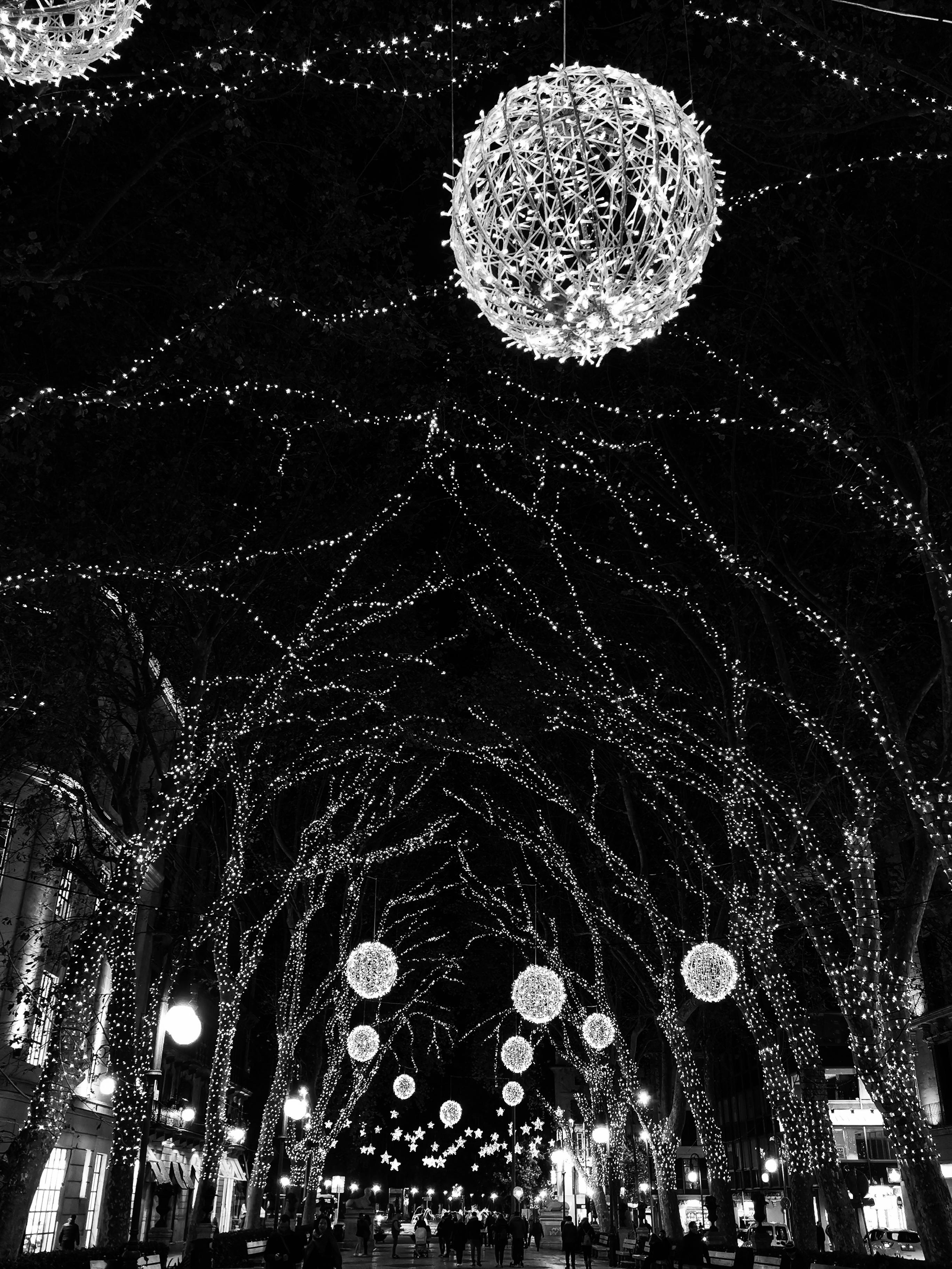 Christmas lights on a shopping street r/blackandwhite