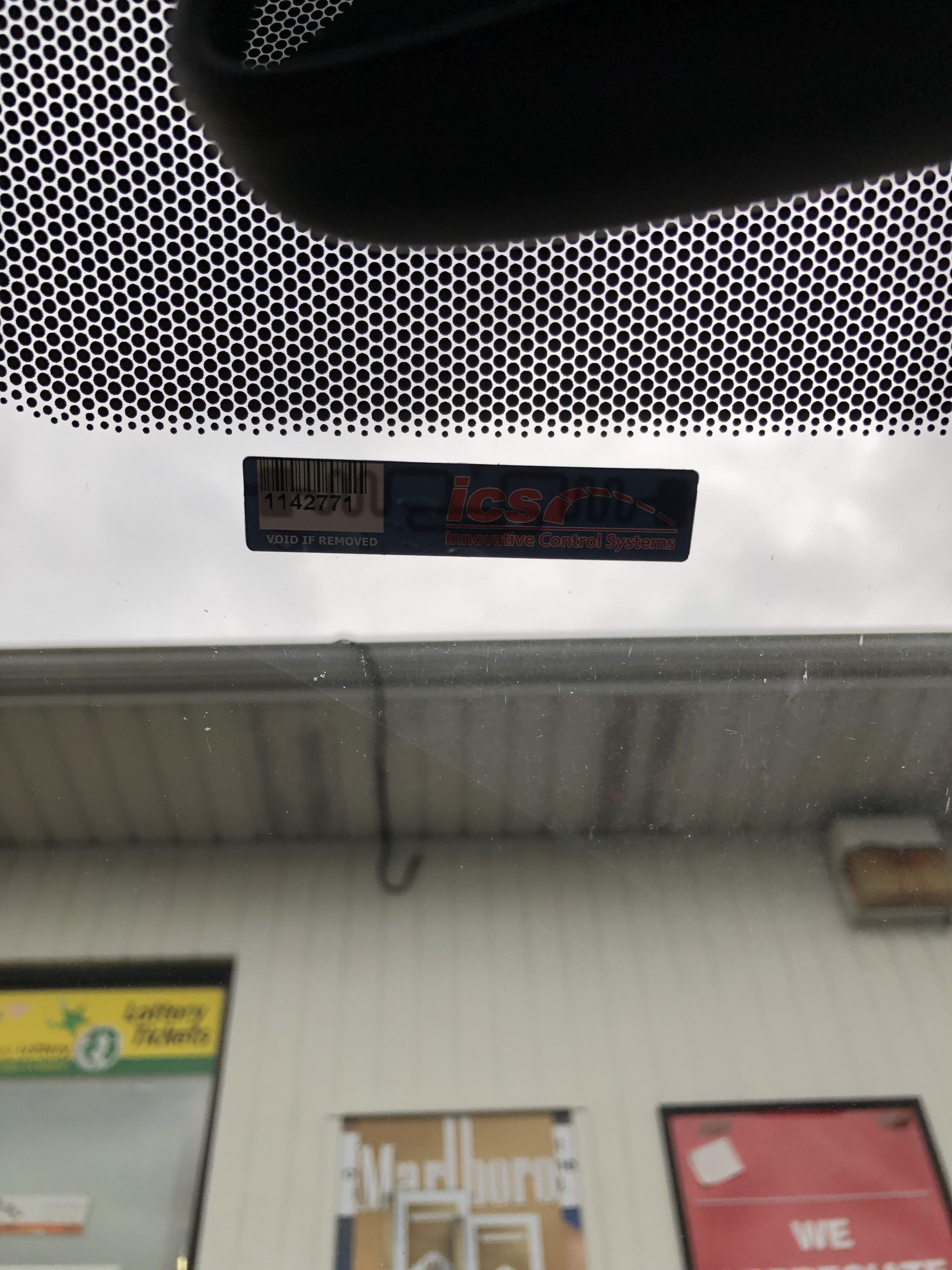 This sticker on my windshield just below my rear view mirror. Looks