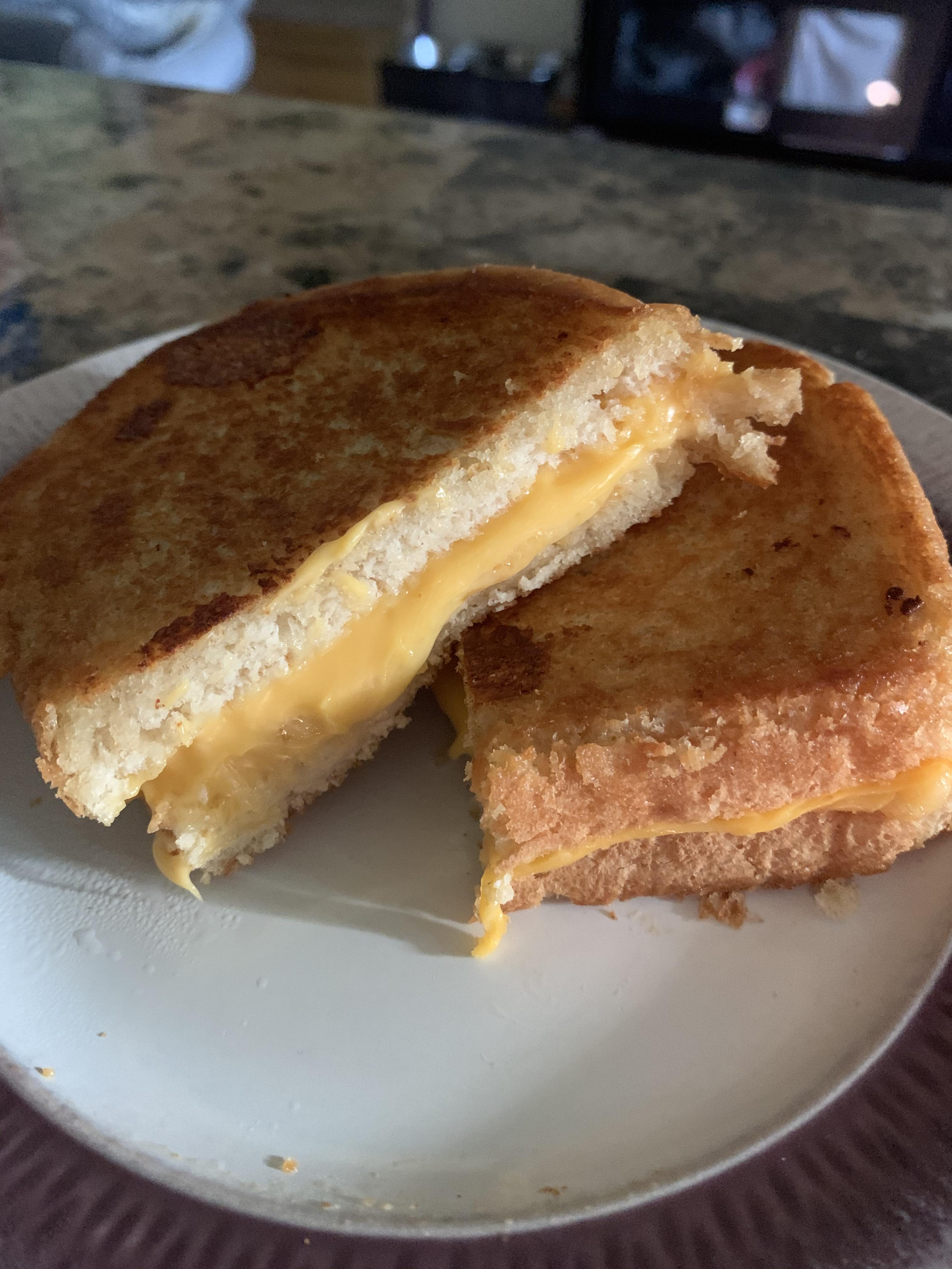Smoked Gouda and sharp cheddar golden deliciousness r/grilledcheese