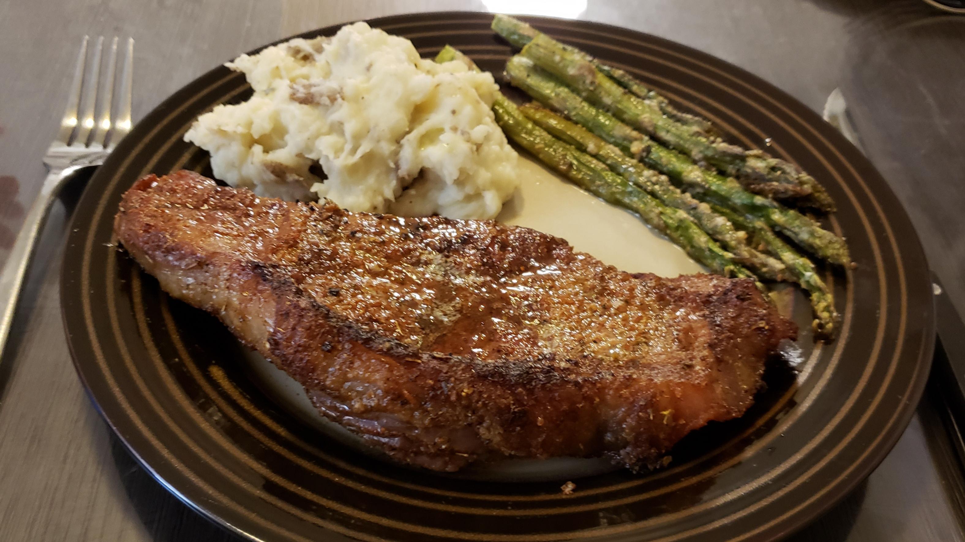 Reverse seared 18 ounce New York Strip steak with dry rub, smashed