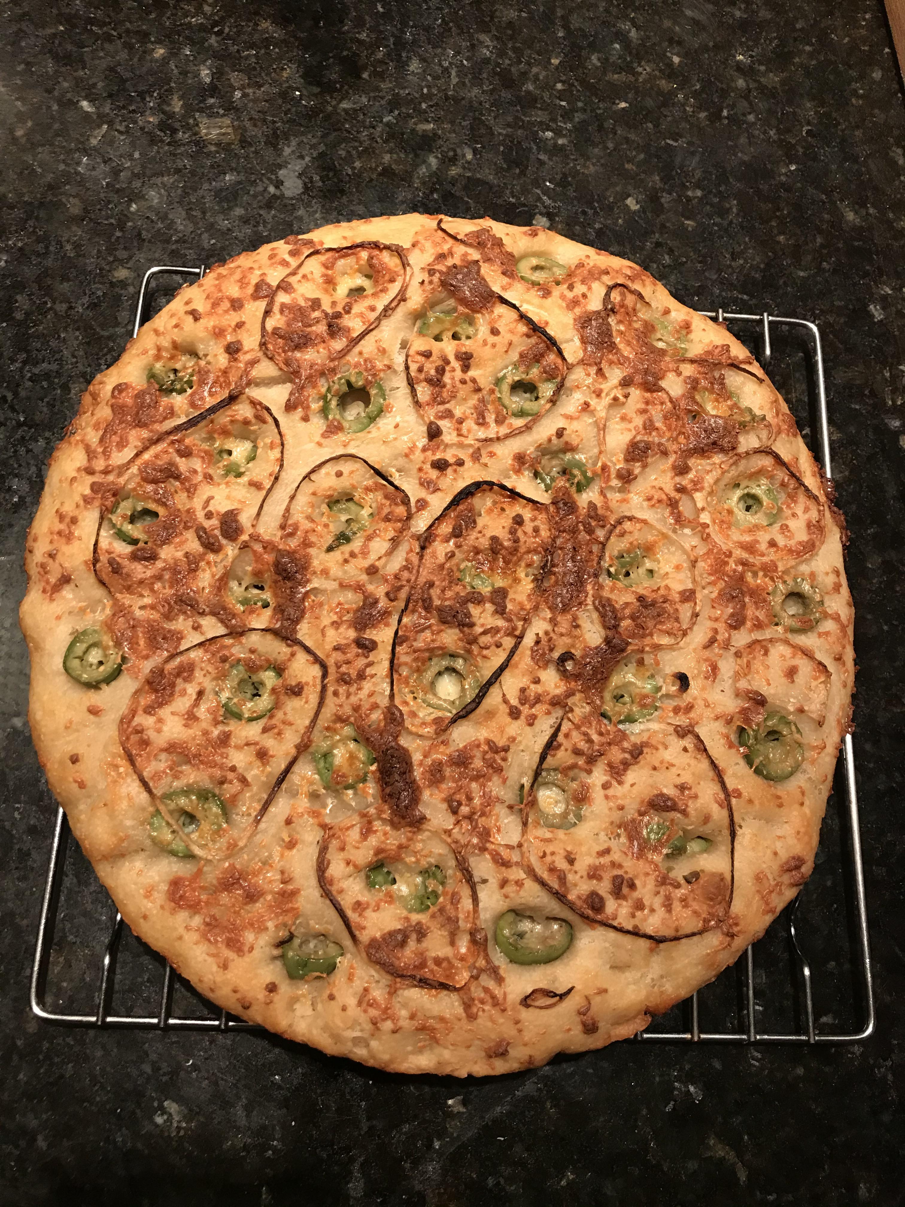 Kenji’s no knead focaccia. I jazzed mine up with green olives, pickled