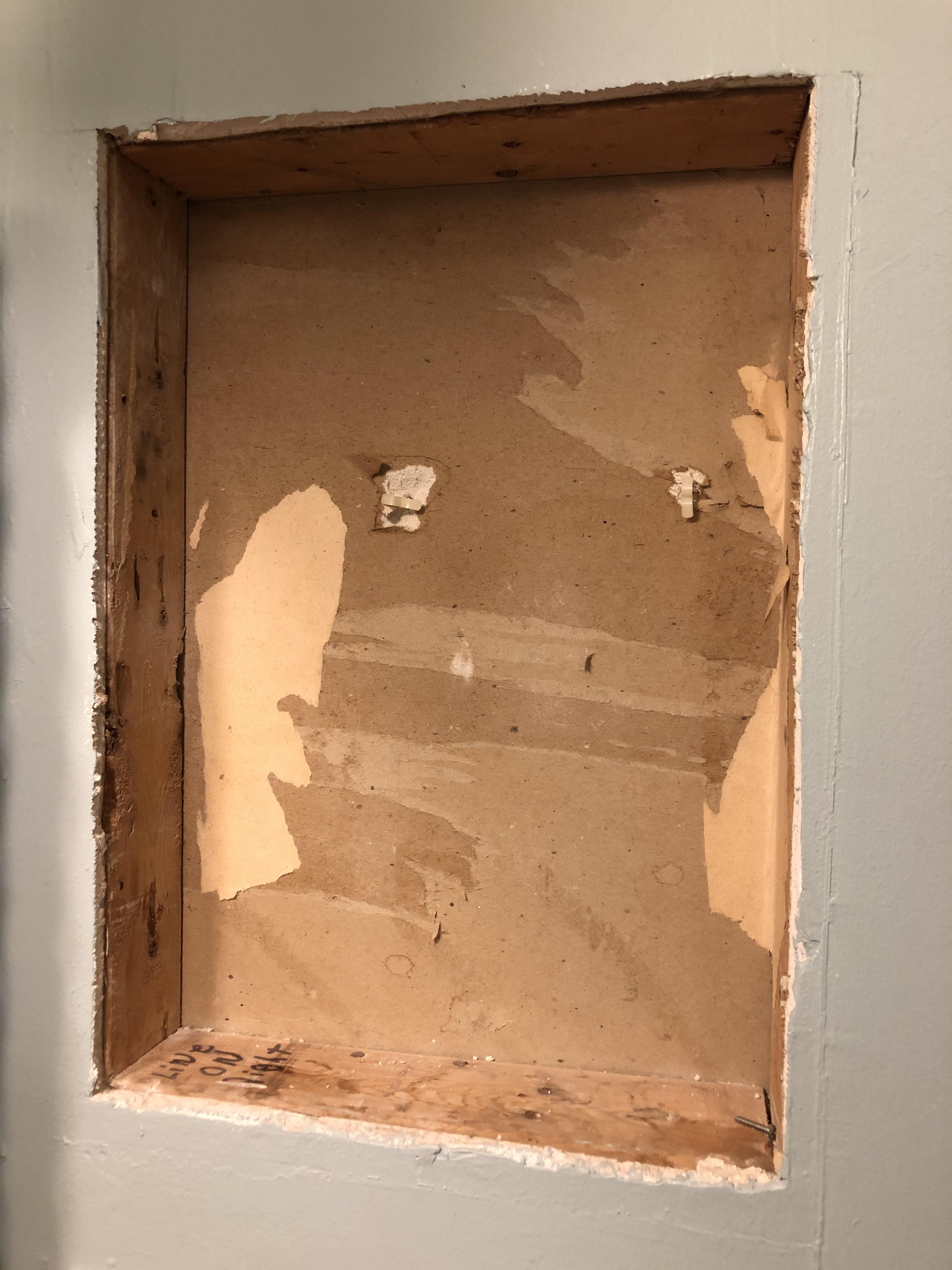 Hole in the wall...how do I fix this? This used to hold an old plastic