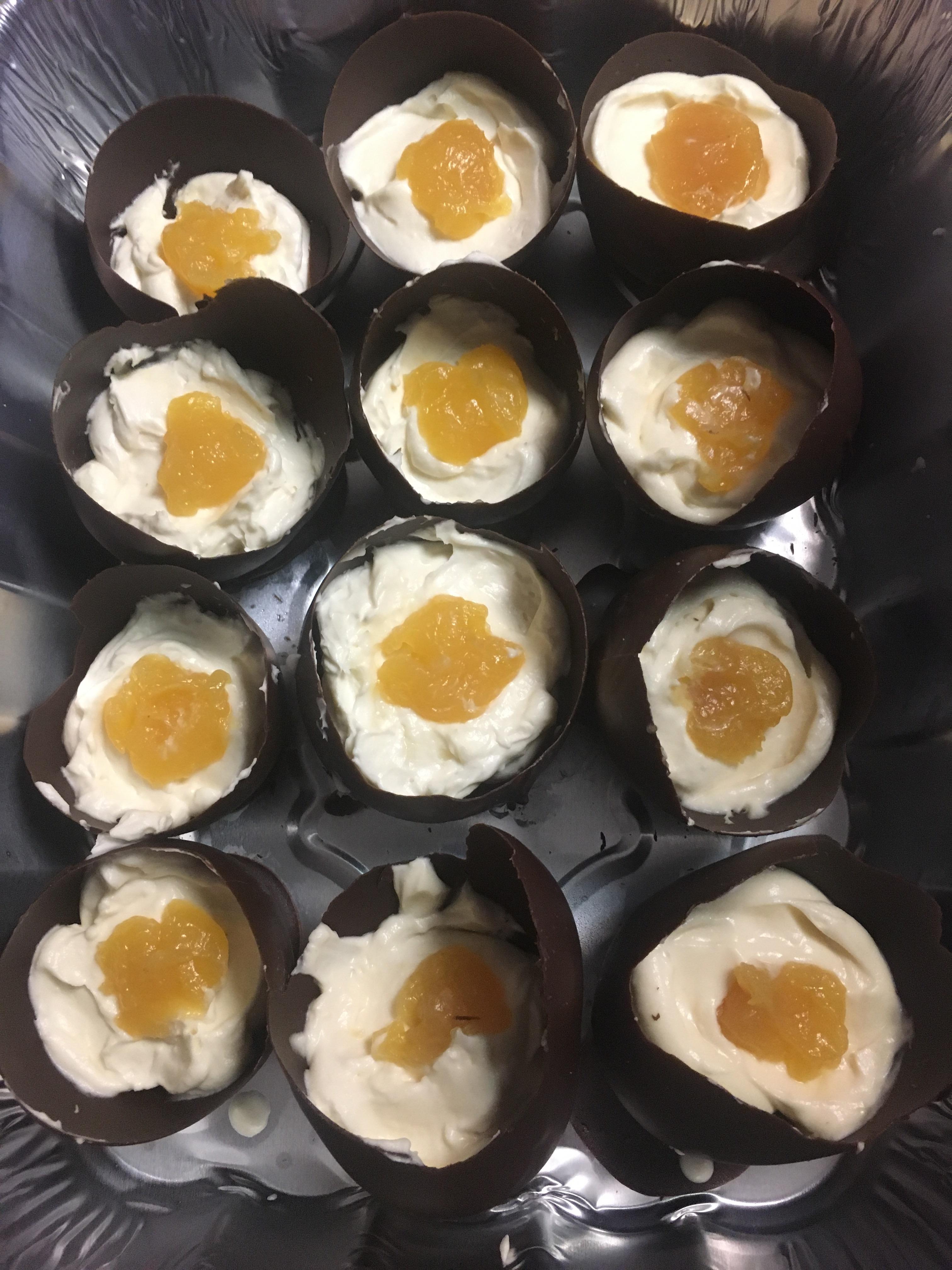 Mom made chocolate eggs filled with cheesecake topped with lemon curd