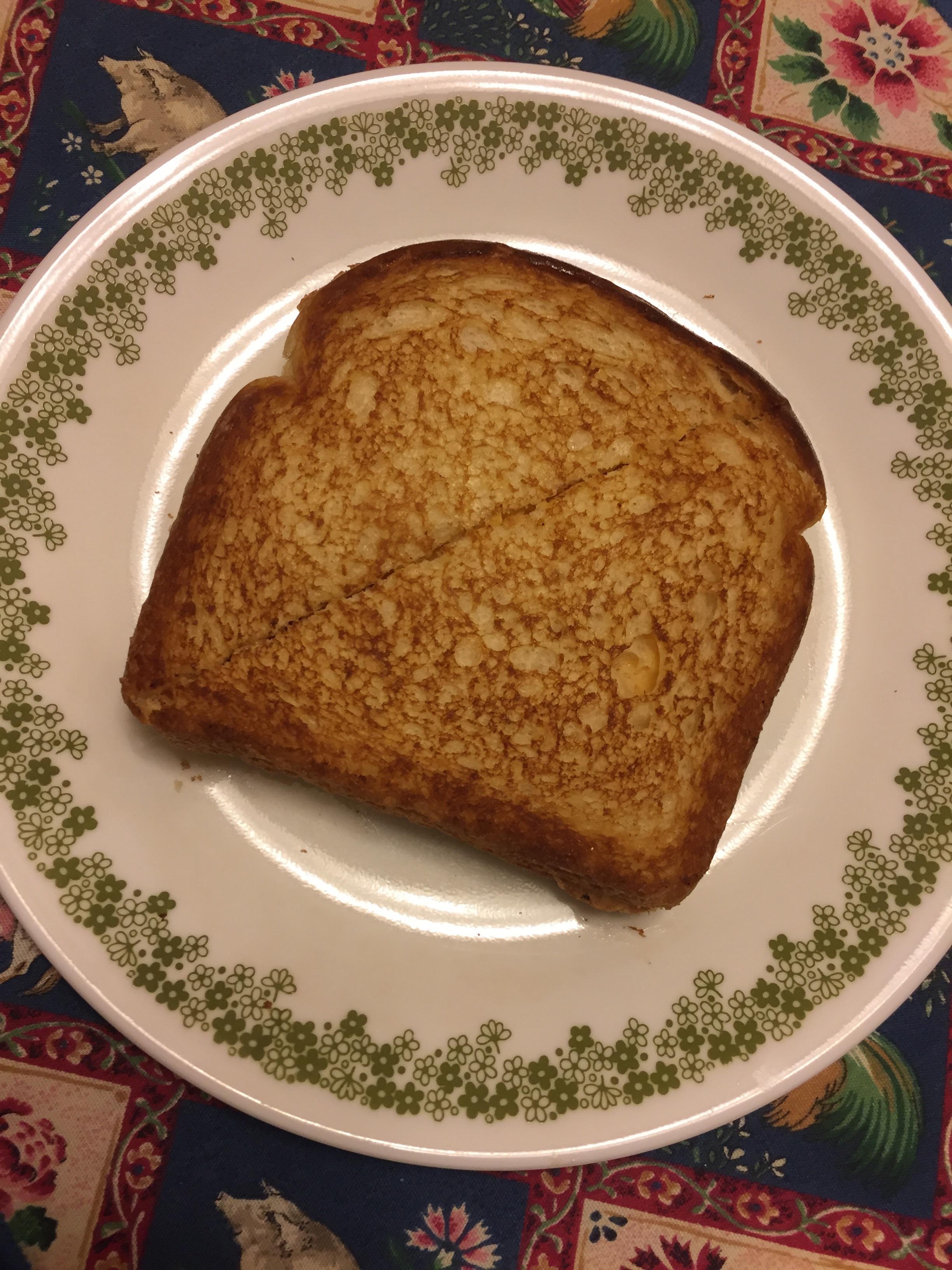 Two slices of American, White Bread, Butter, Cast Iron r/grilledcheese