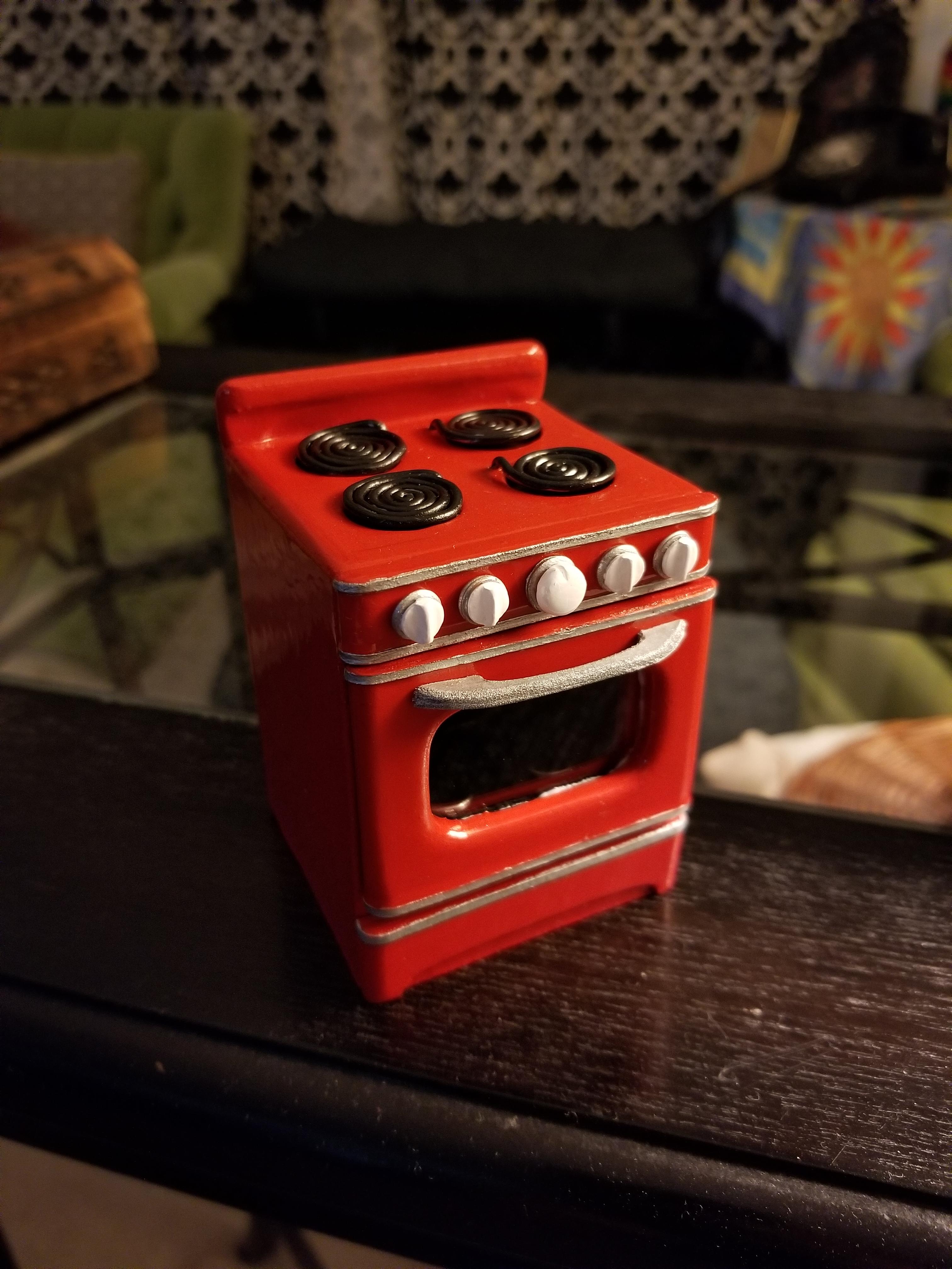 Just finished up this stove! Sculpey for the knobs, wire for the burners, and the rest is made