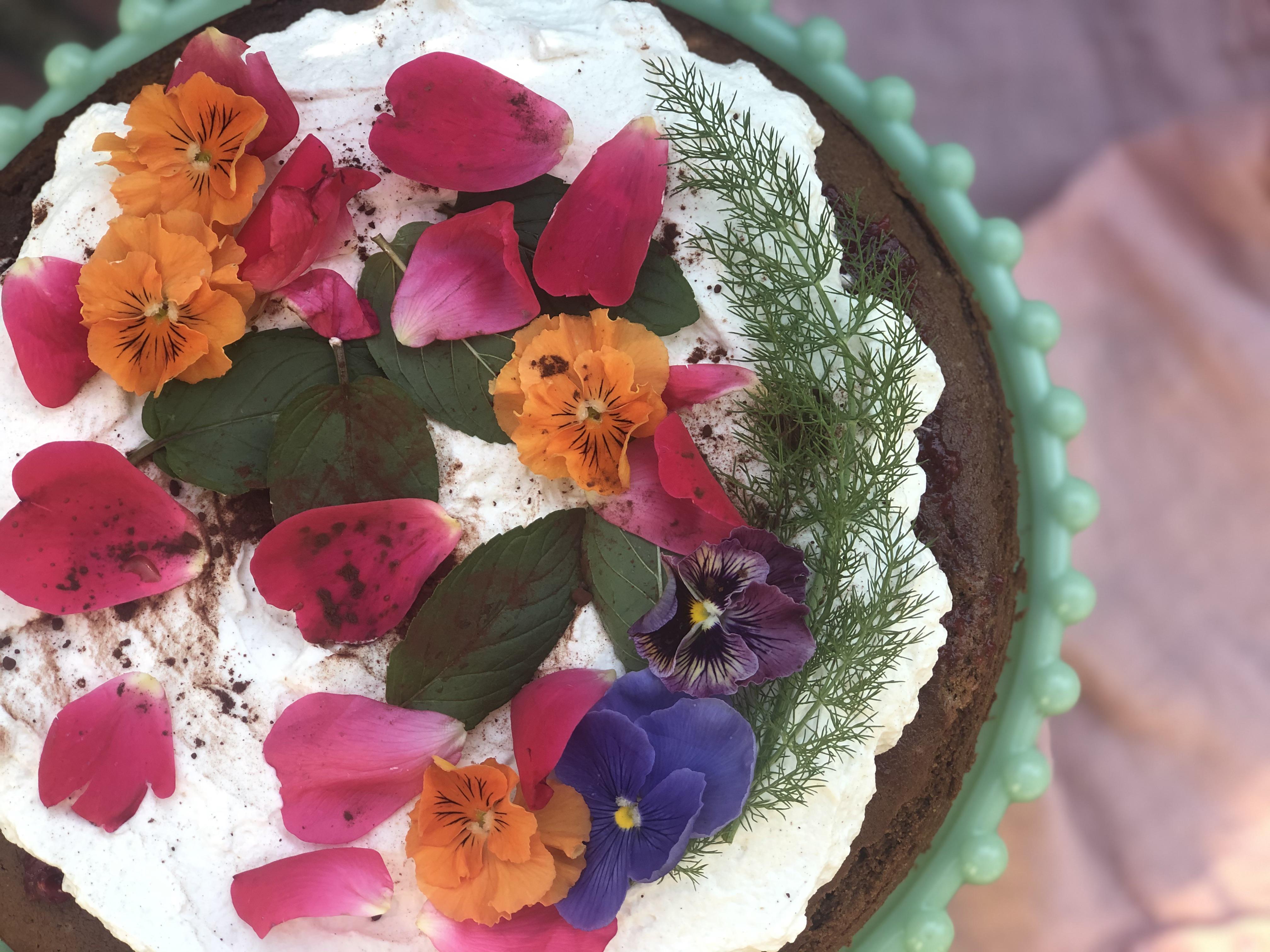 [OC] Beltane cake chocolate, cognac, & spices, amaretto glaze, layered with raspberry rose jam