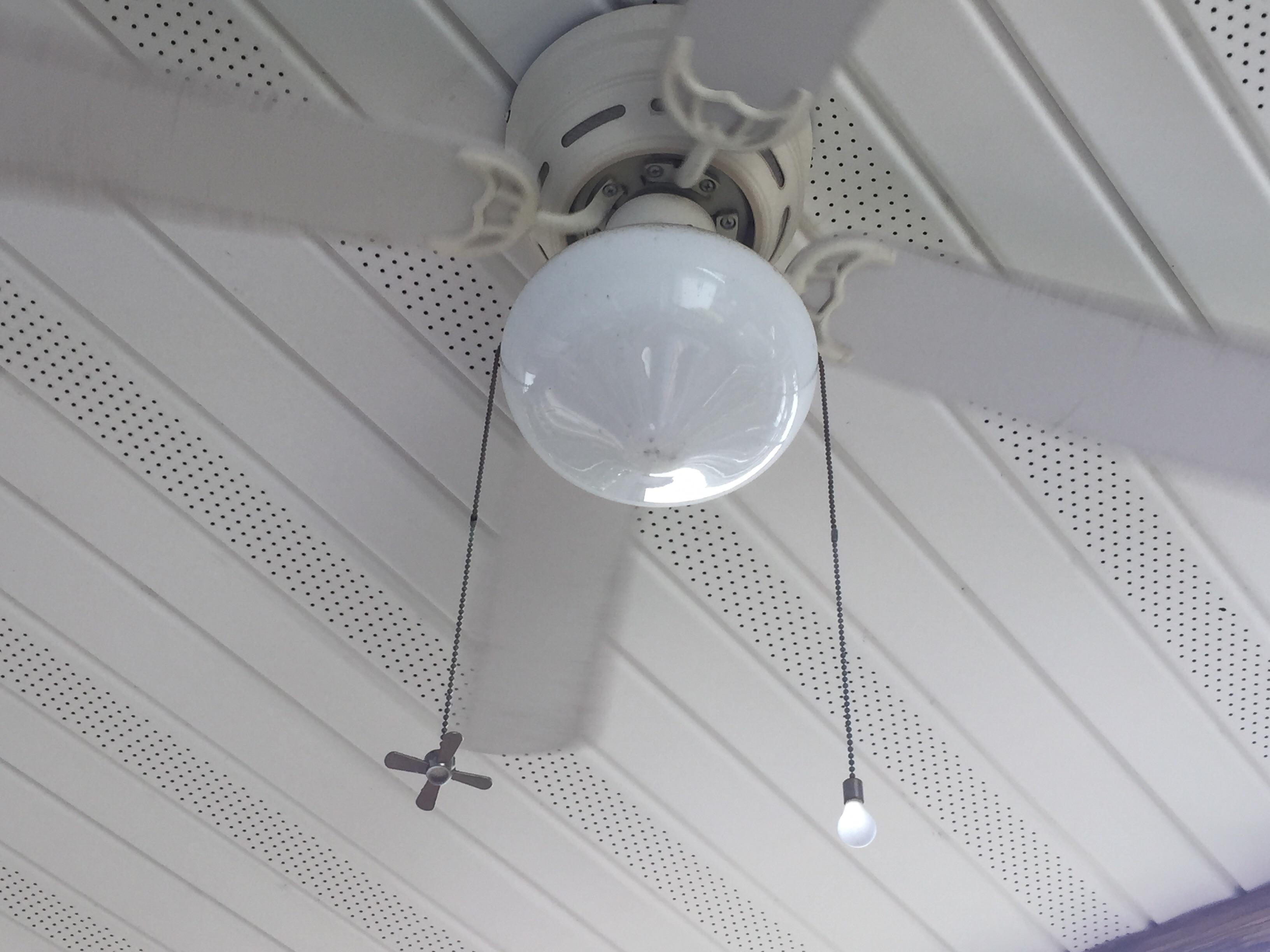 This ceiling fan differentiates the light and fan chains with a light