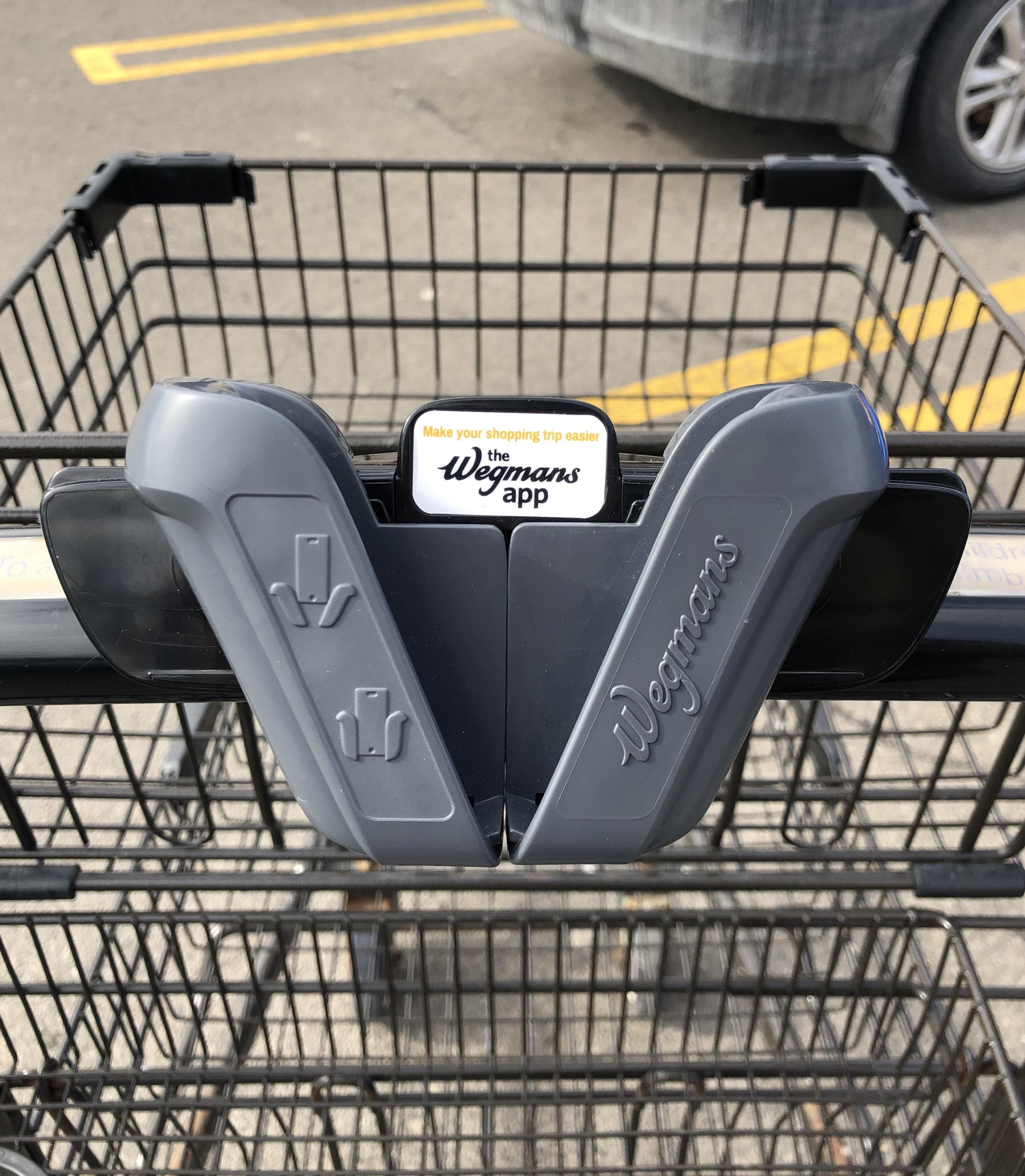 My grocery store has a phone holder built into their shopping carts r