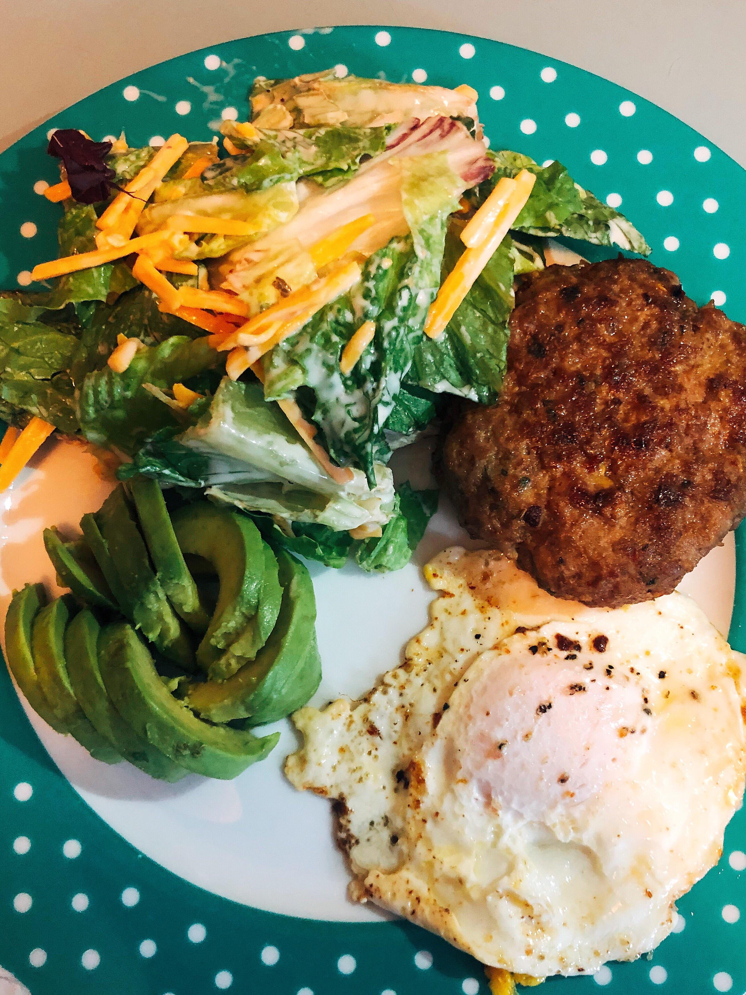 Homemade lamb burgers (using pork rinds and an egg as a binder), eggs