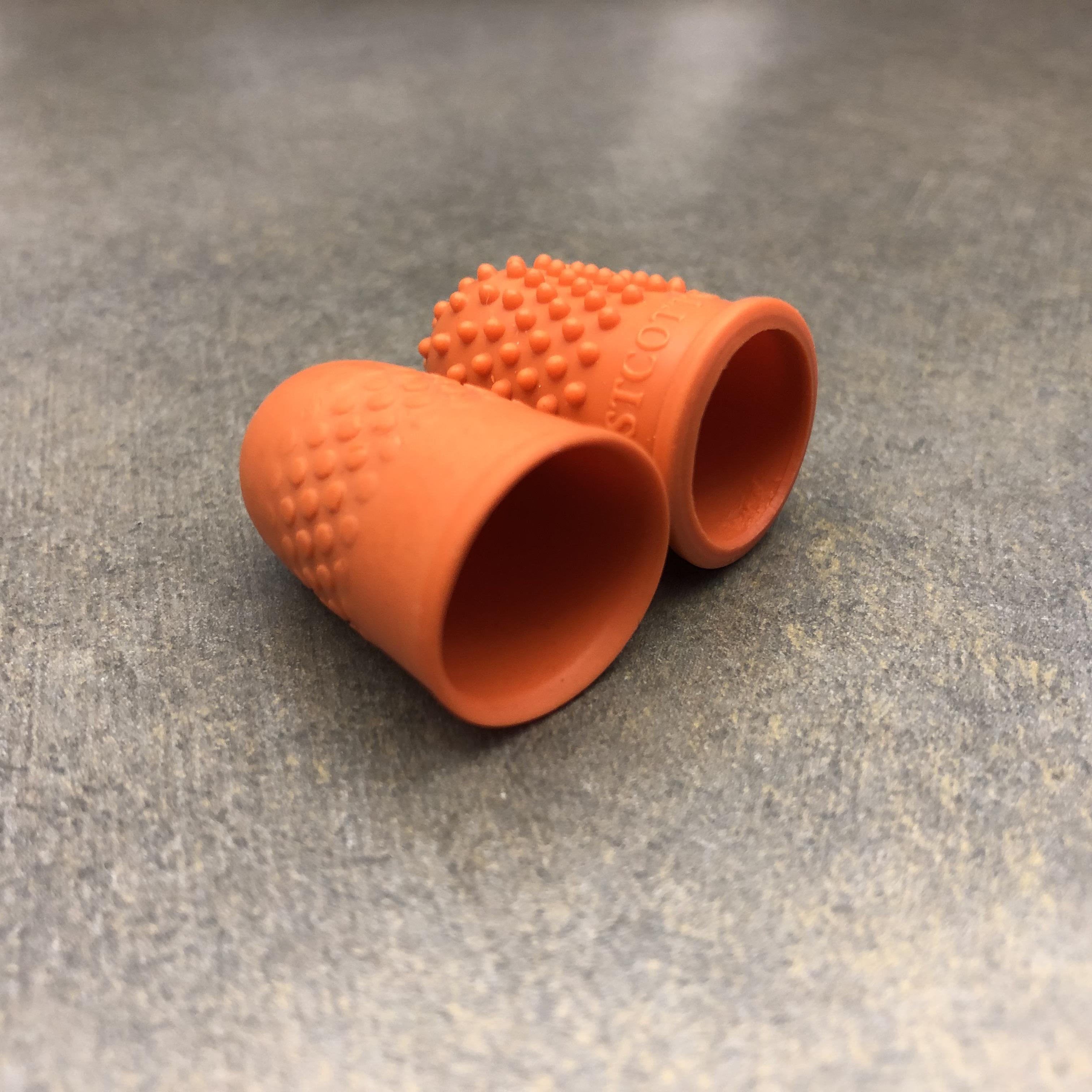 Exact same rubber fingertip, left one has flipped through hundreds of