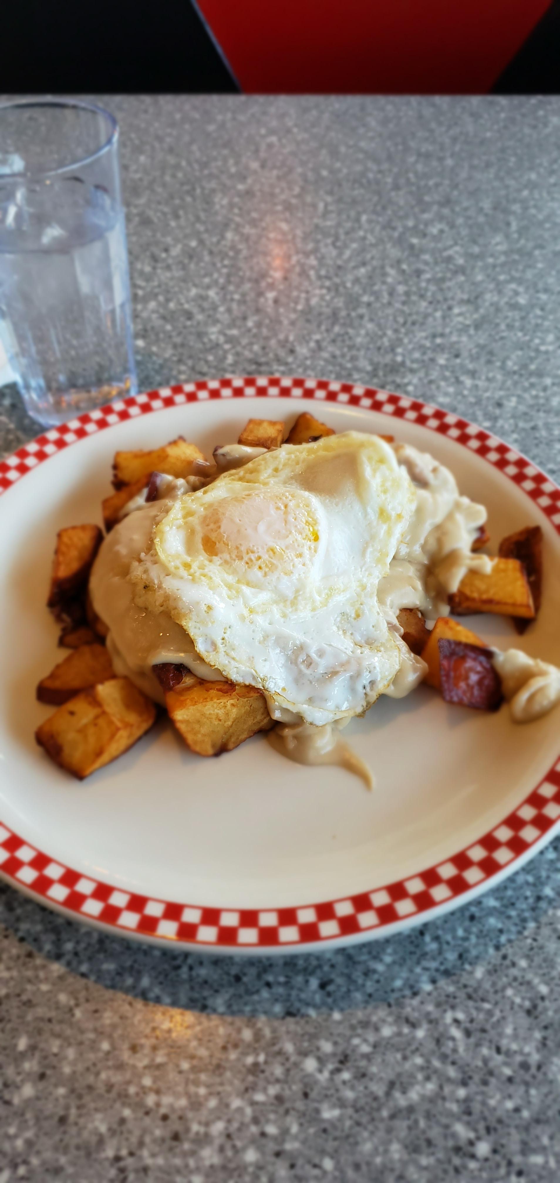 [I ate]Southern home fries and sausage gravy and egg r/PutAnEggOnIt