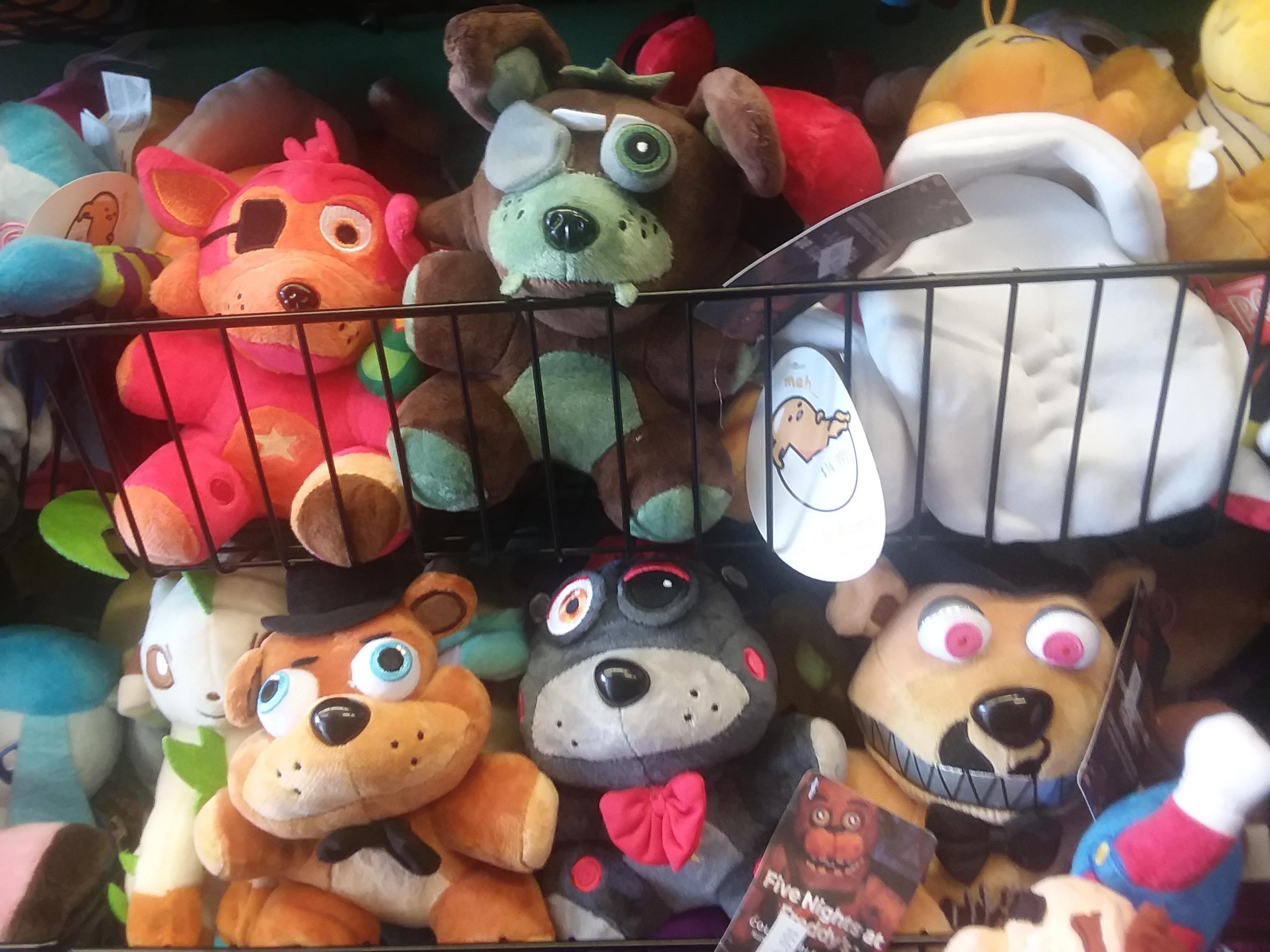 I found these wonderful bootleg fnaf plushies in ocean city r/fivenightsatfreddys