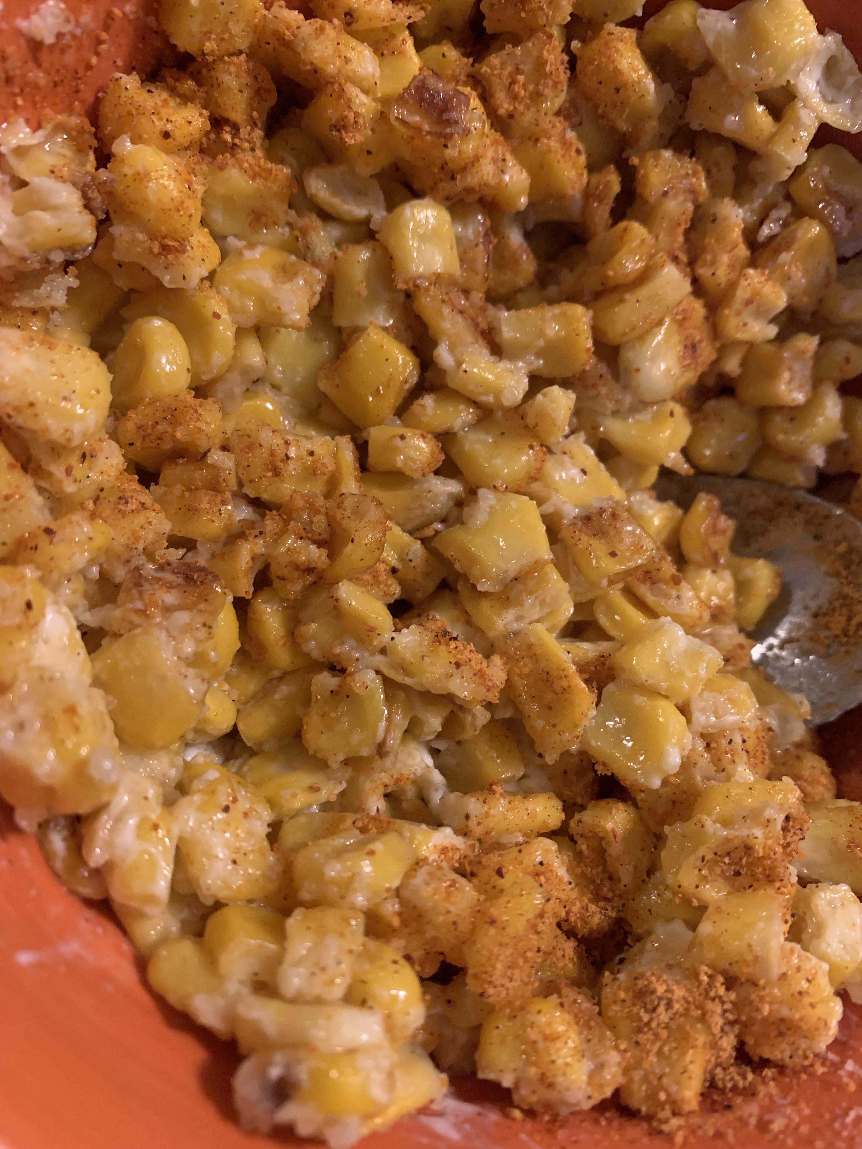 Bowl of “close enough” elote. Canned sweet corn drained and sautéed in butter, stirred in a half