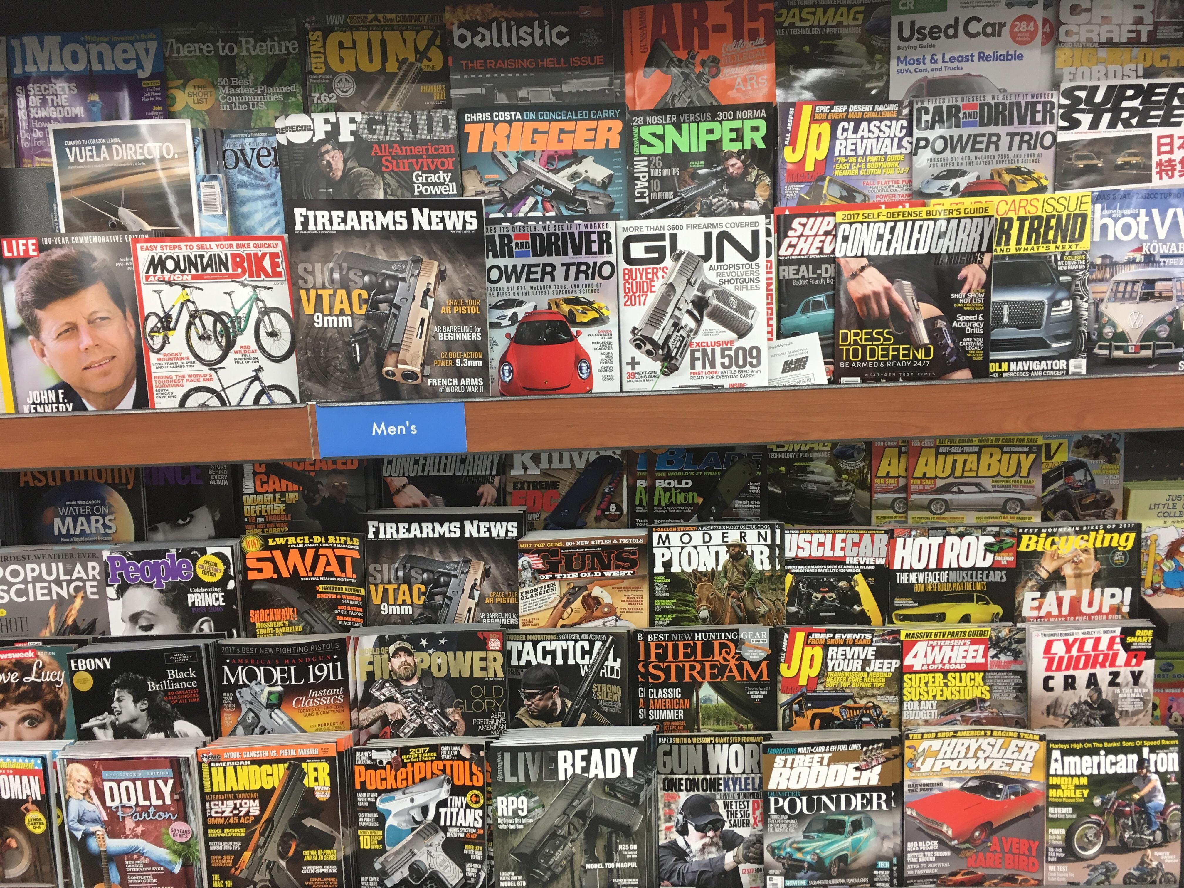 How many gun magazines can you find on this stand at Walmart? r