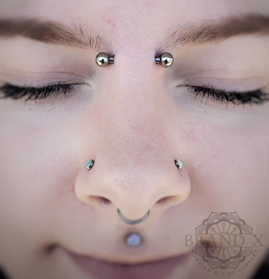 12g bridge piercing done by Brian Fowler at Brand X Piercing in
