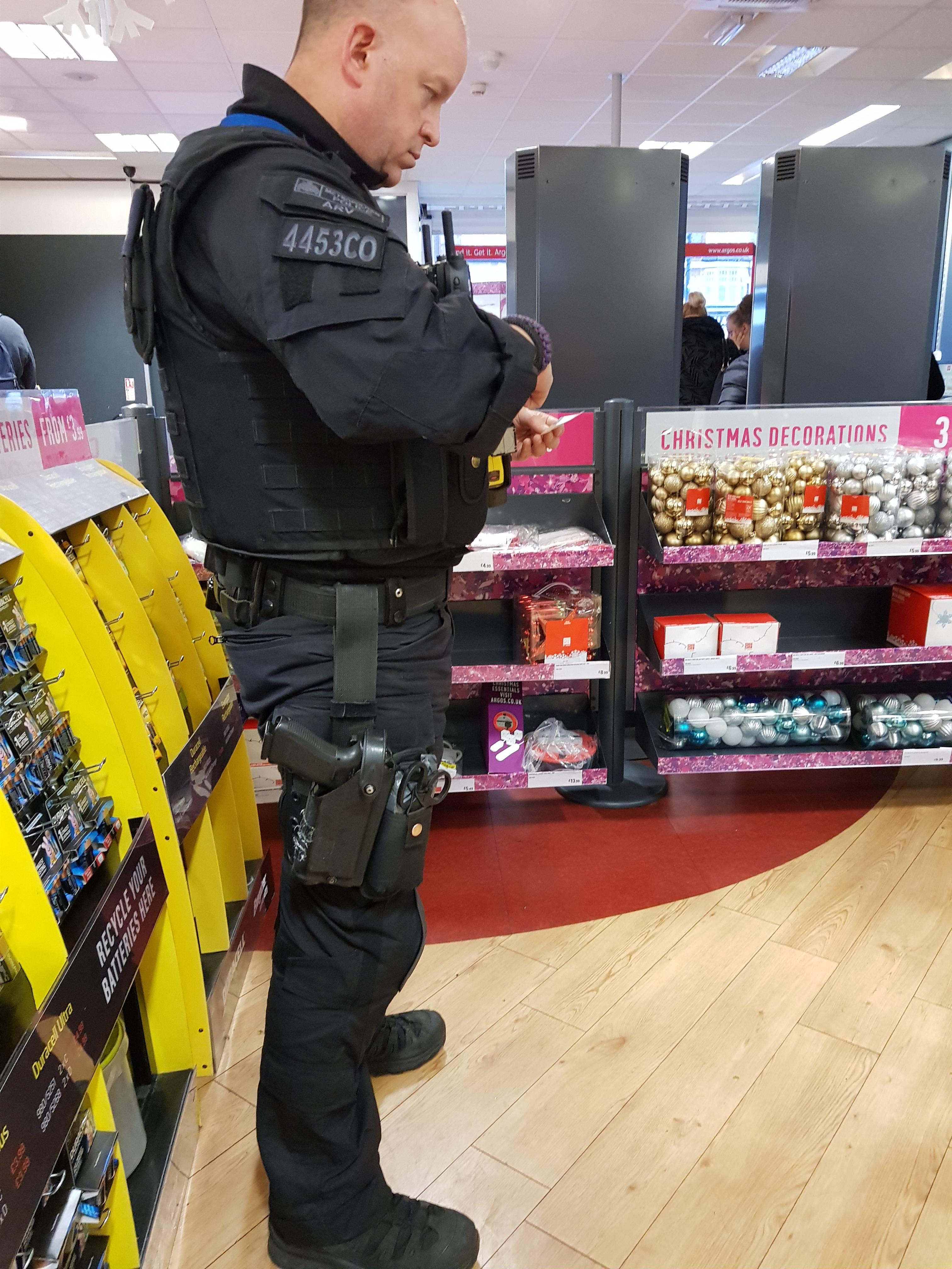 Armed police officer in Catford Argos. He was showing off all his