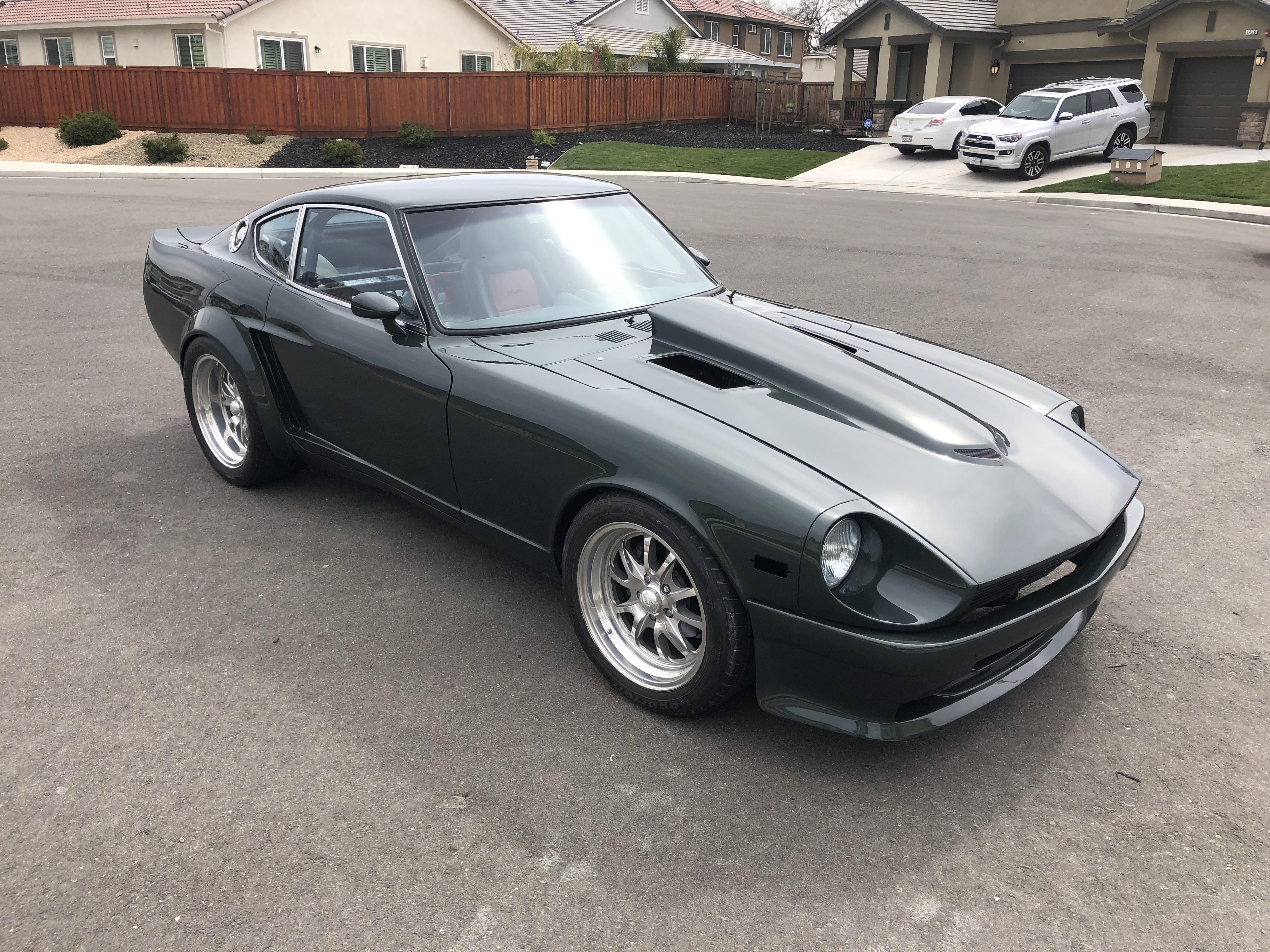 New paint job on my 1971 240z custom wide body. Dark green metallic