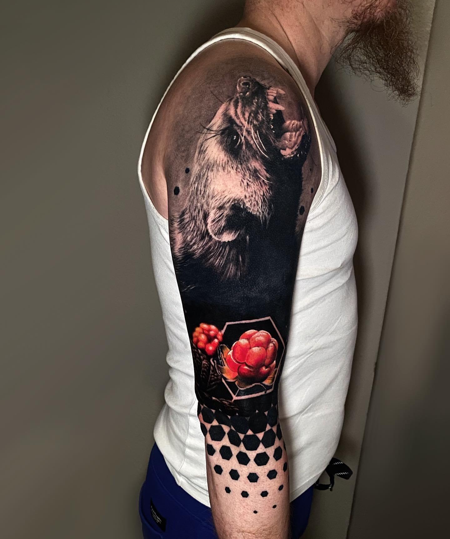 Sick wolverine and cloudberries tattoo by Michael Stade big time