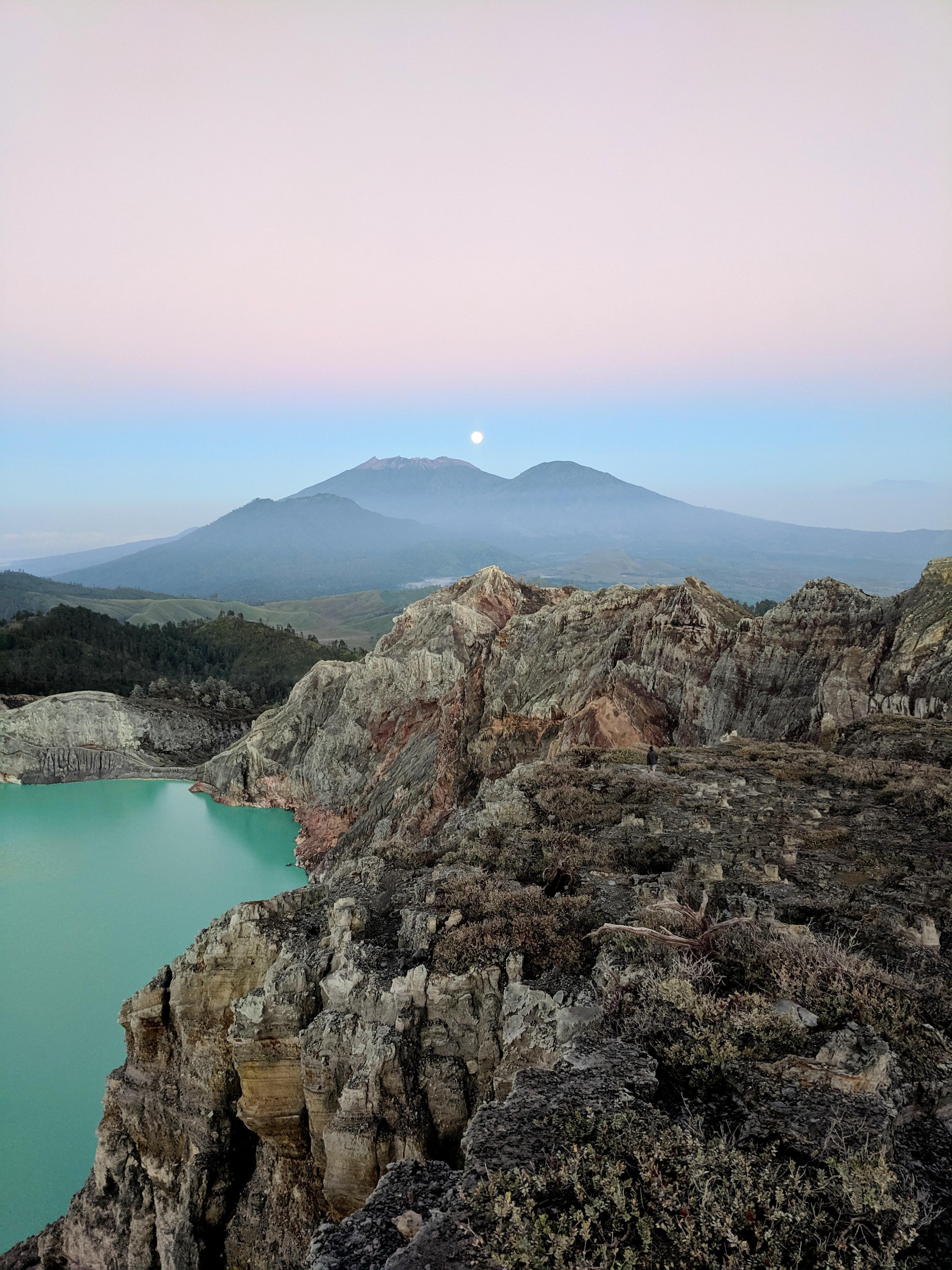 Moonset over the world's largest acidic lake in the crater of Mt. Ijen