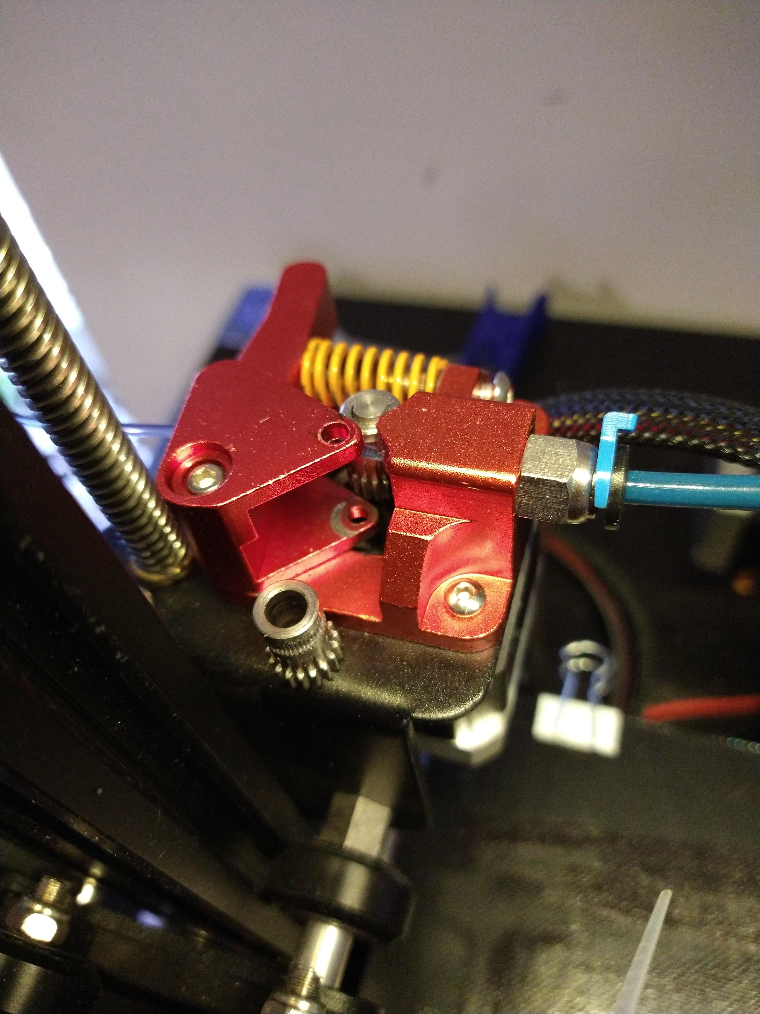 my dual extruder gear keeps grinding itself in the housing on my ender