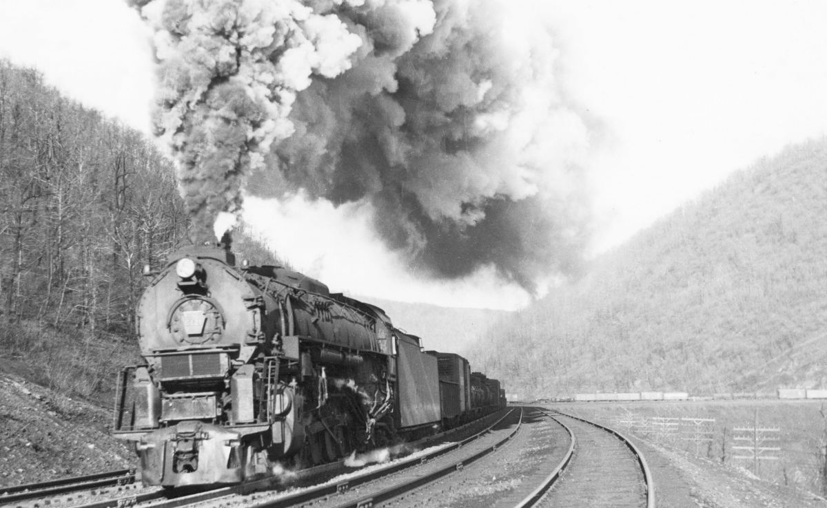 Pennsylvania Railroad J1 2104 6421 lugs a freight train up and out