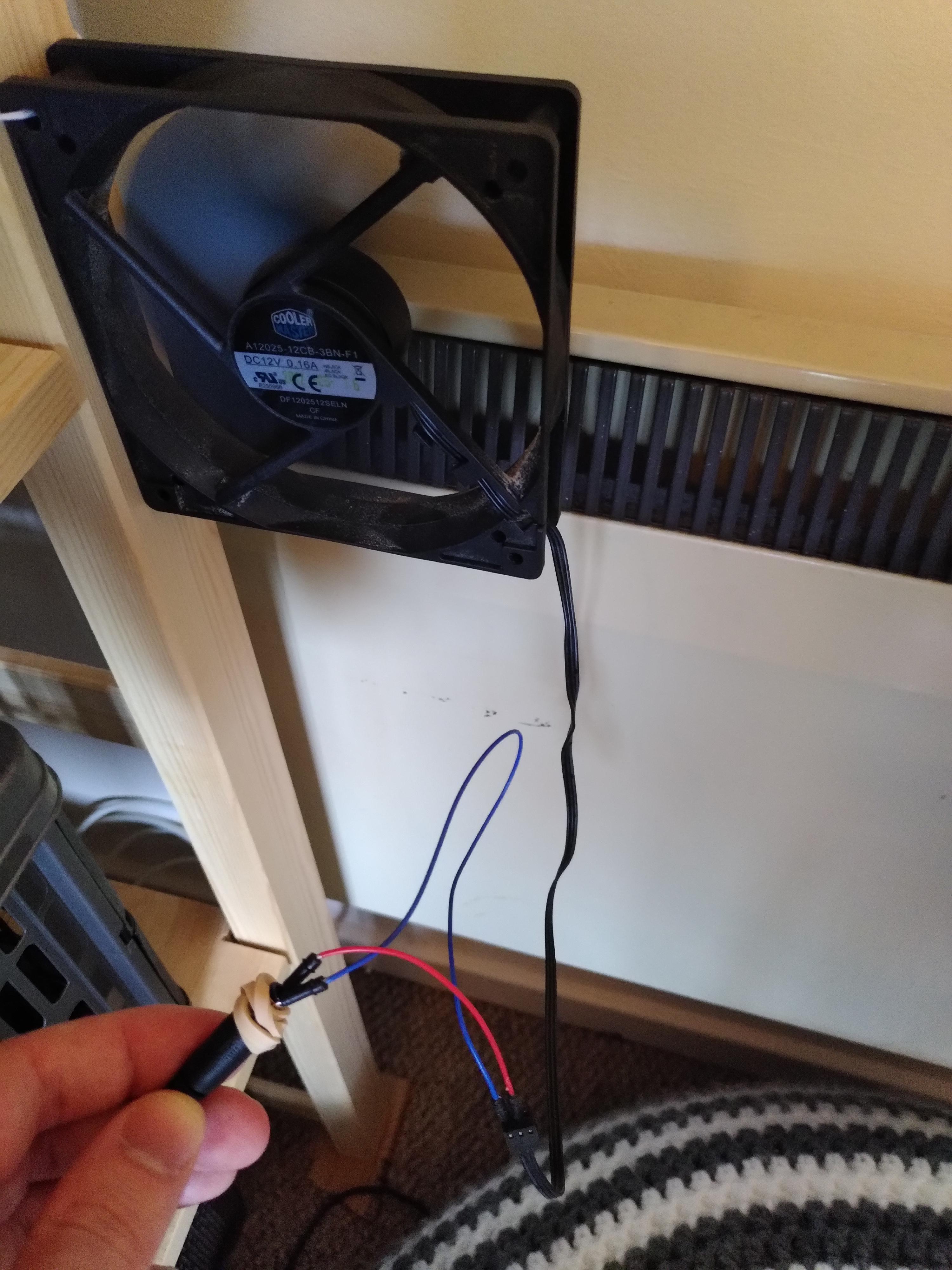 Electric radiator doesn't circulate air very well; spare PC fan and old