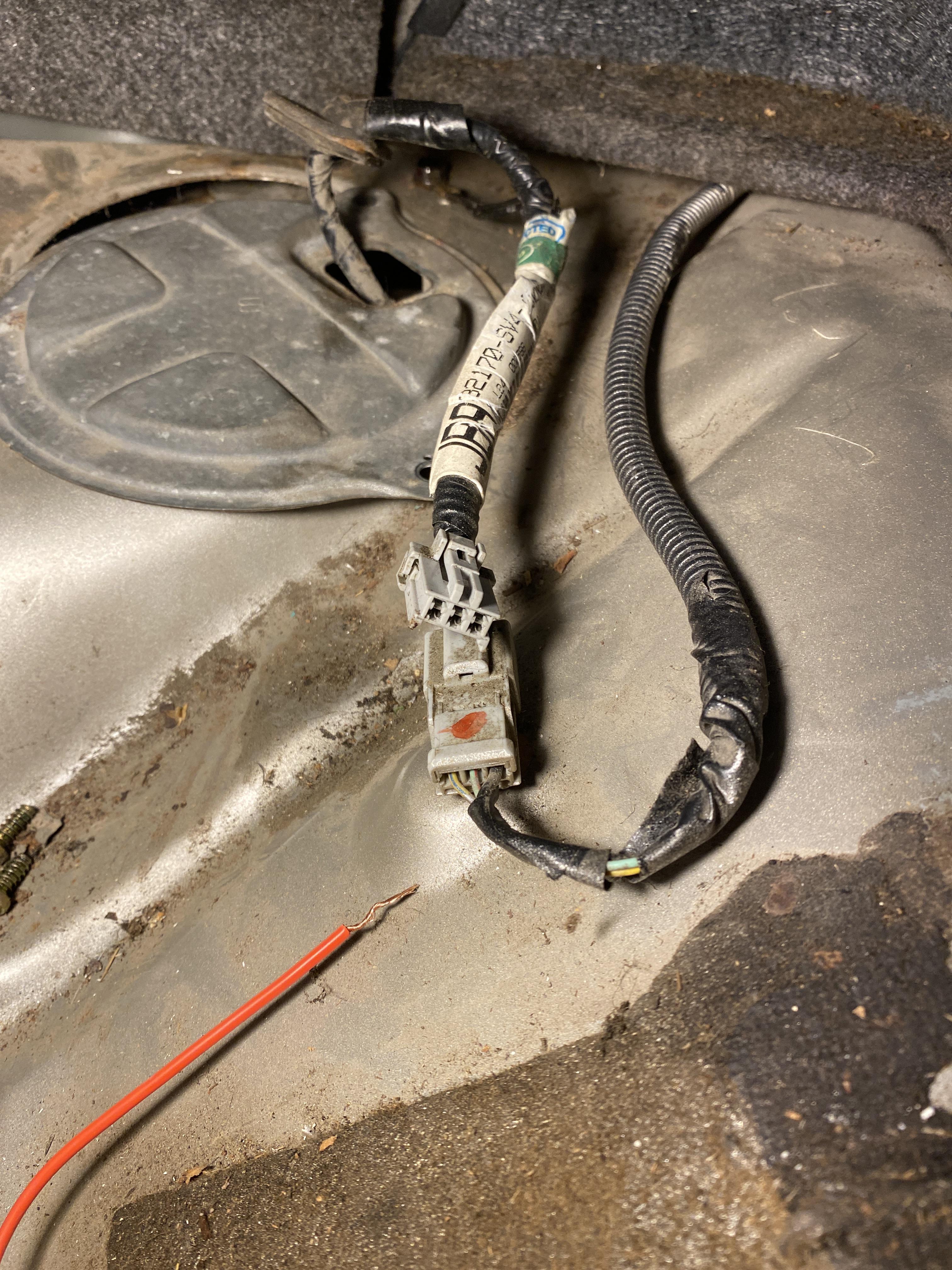 Drain fuel tank 1995 Honda Accord. When I apply 12 volts to the outside 2 pins I hear the pump