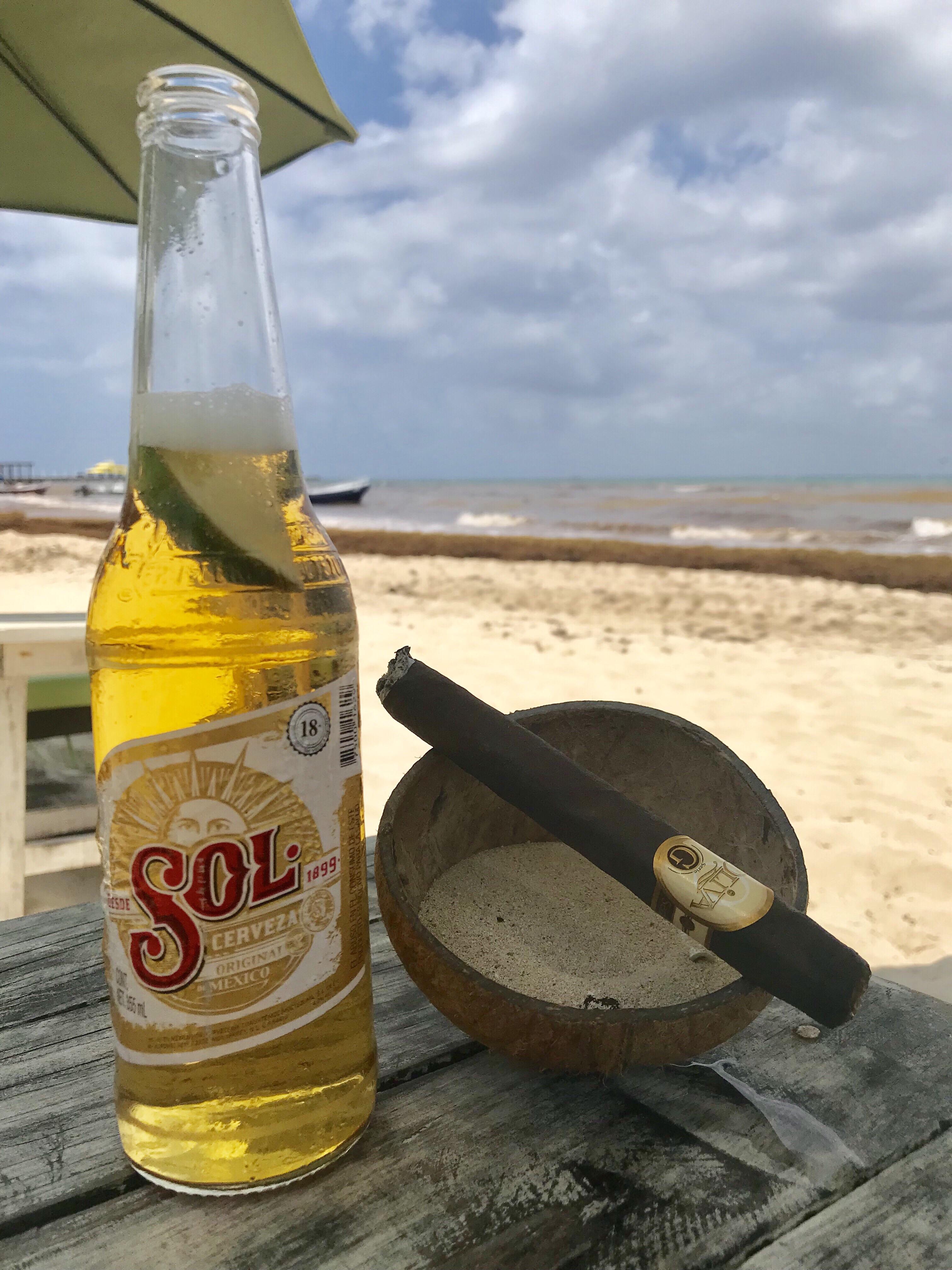 Playa del Carmen and beer on the beach with a special treat r/cigars