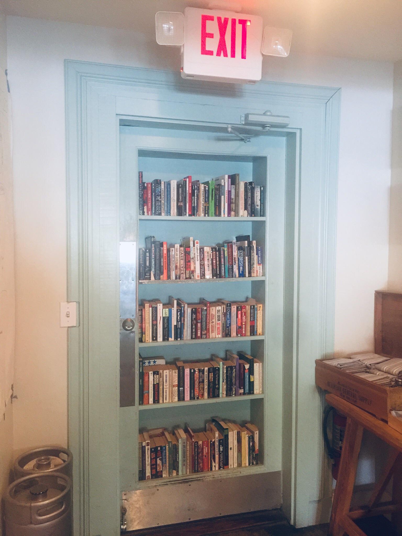 Bookish Door at Hog & Hominy (Memphis TN pizza place) [OC] r/bookshelf