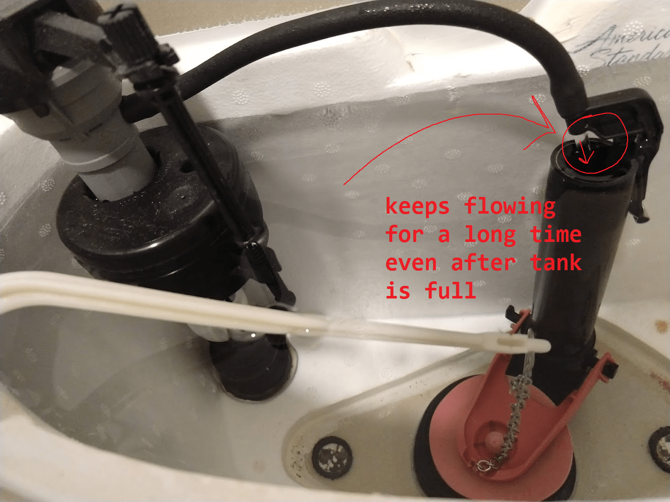 What's wrong with my toilet? Water keeps flowing out of this hose even after the tank is full