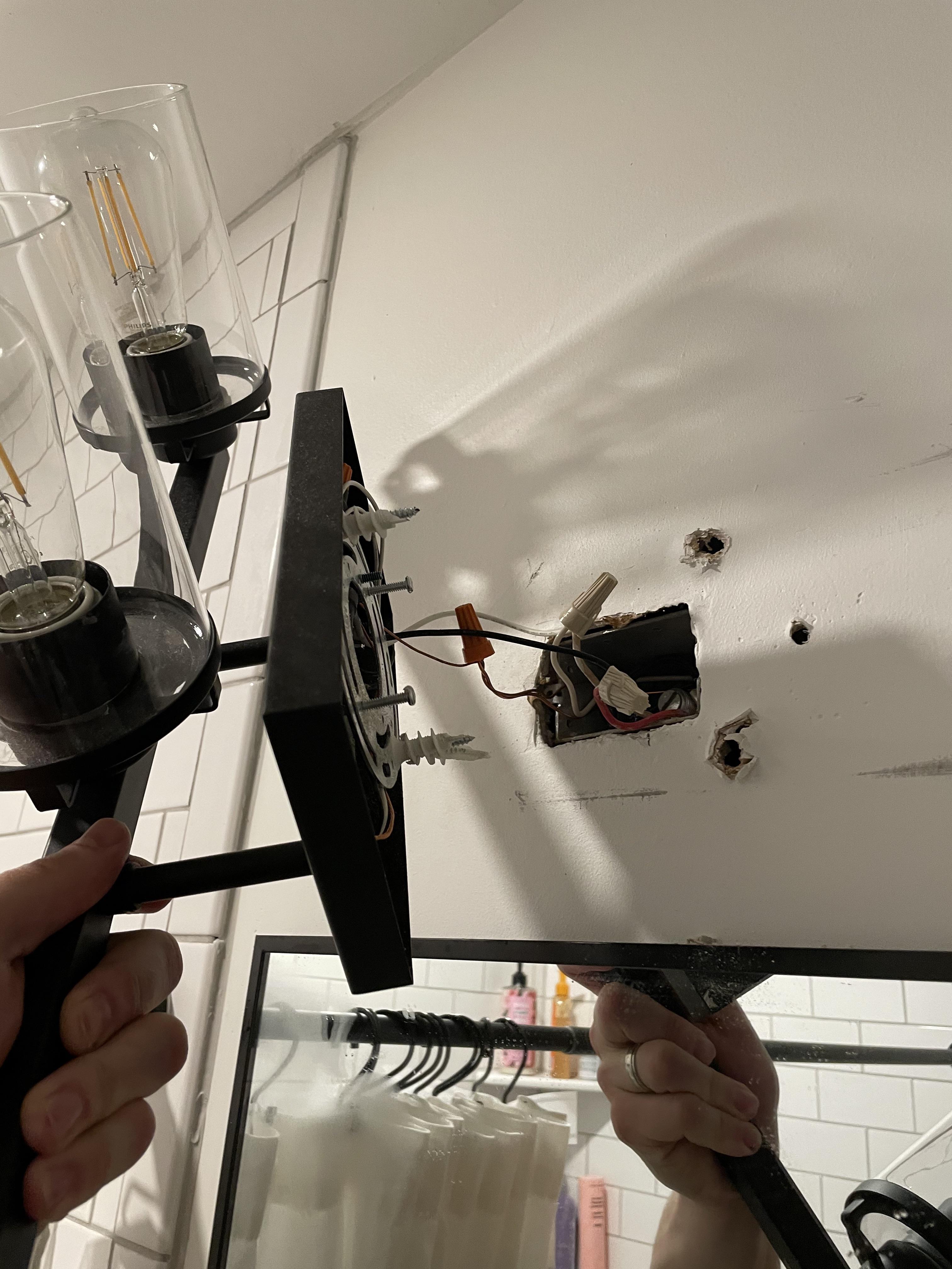 Apparently this is how my contractor centered the vanity light over the