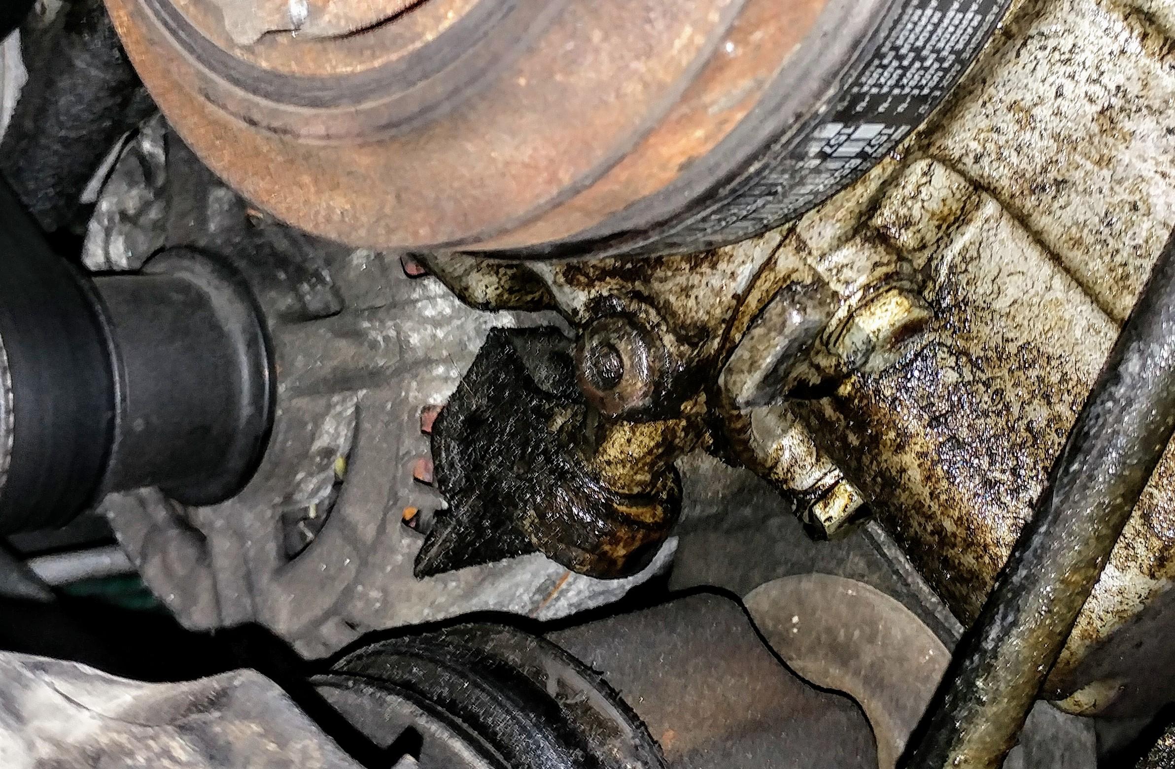 Anyone know where this oil leak in coming from? (Drip forming on bolt