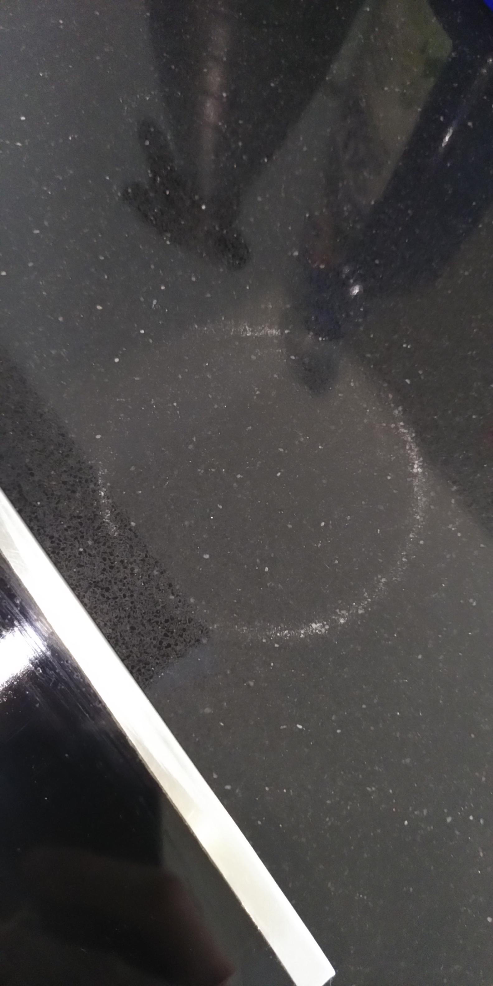 Burnt countertop but not sure what material it's made of. Please help