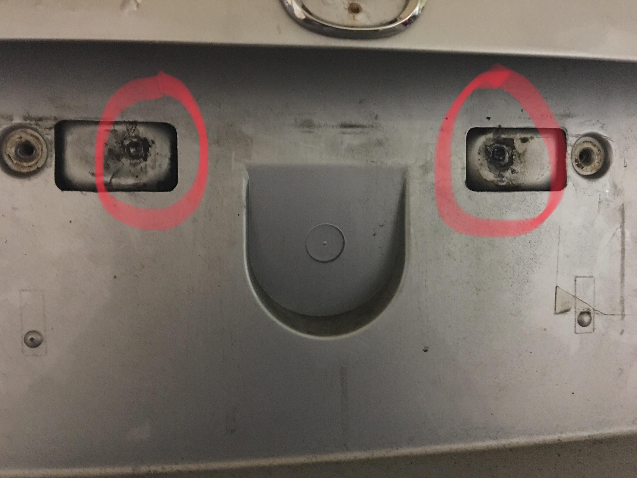 License plate bracket holes have broken bolts. Two extra holes exist on