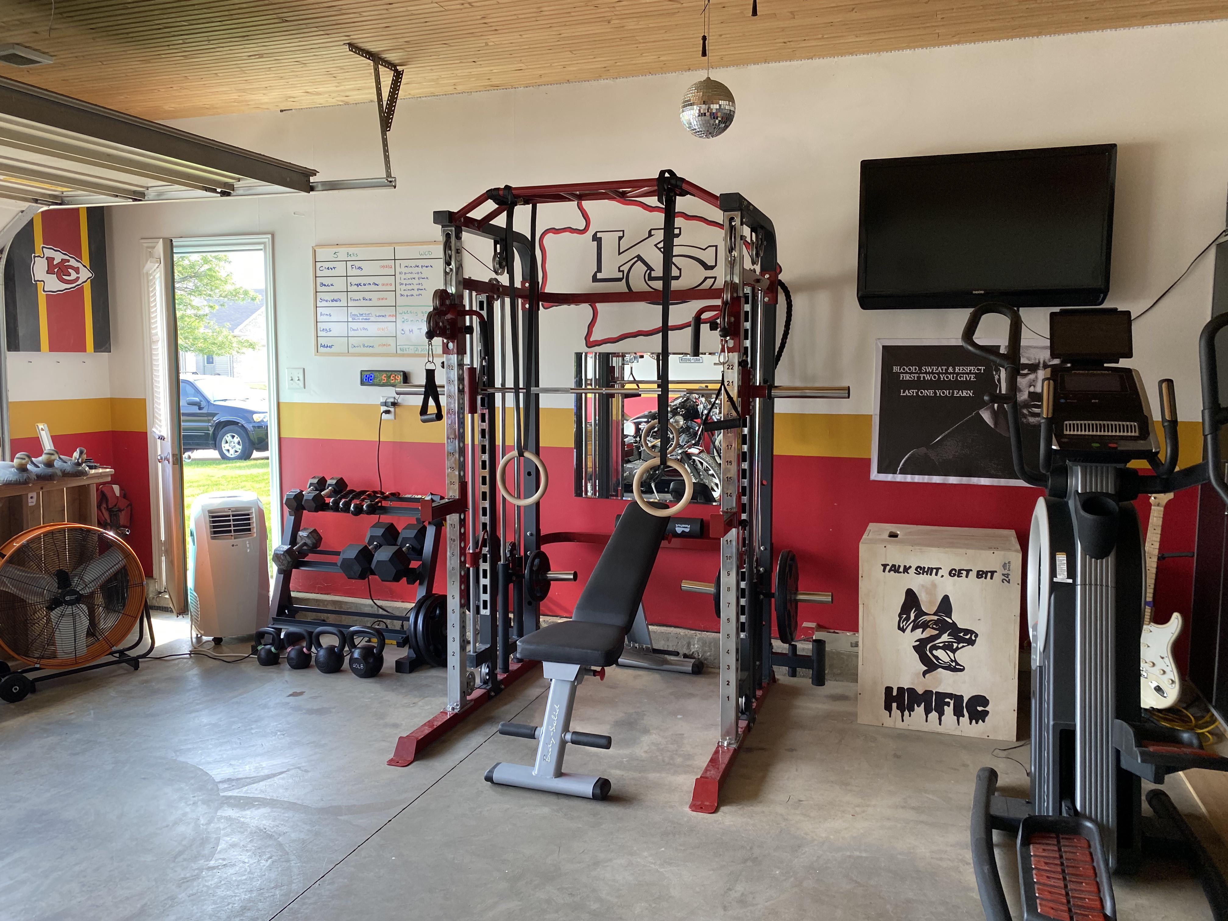 My garage gym with chiefs trim r/KansasCityChiefs