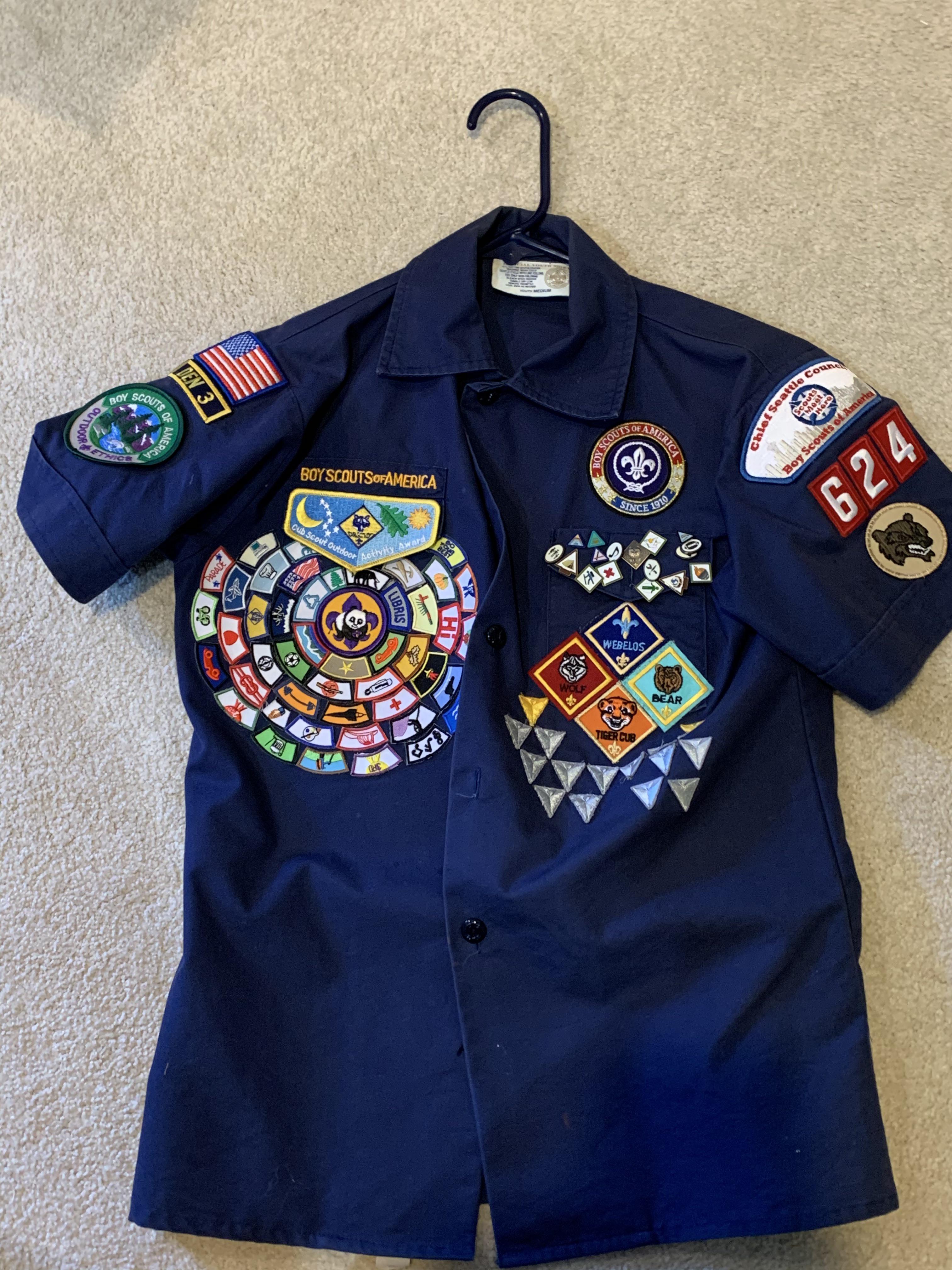 Found my old cub scouts uniform. Didnt remember that I had this many