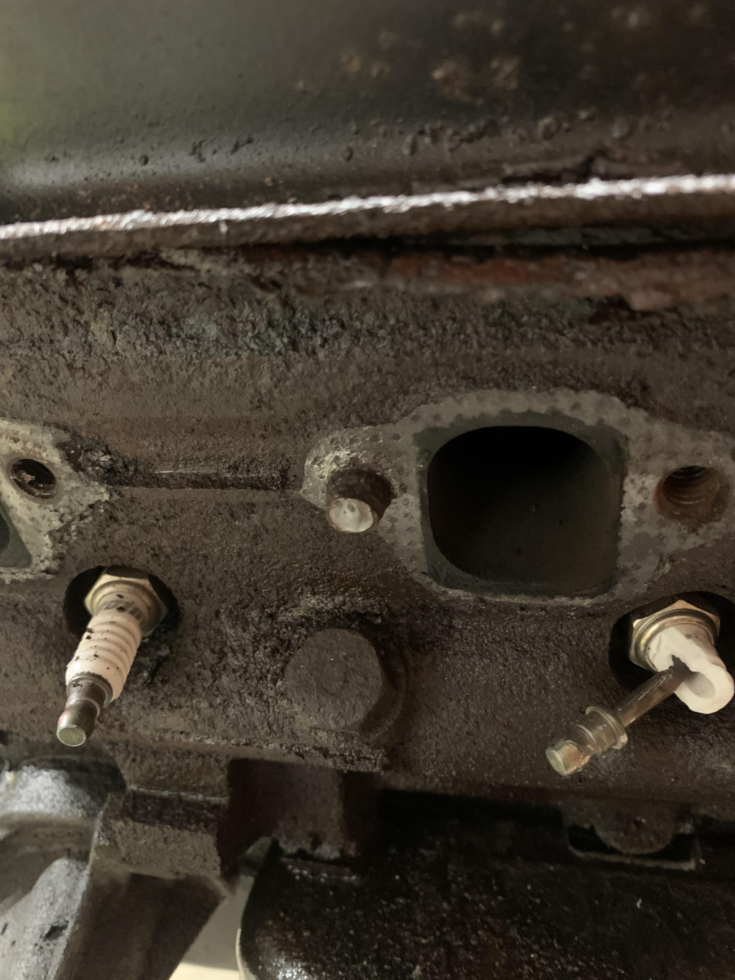 Need a little helptearing down a junkyard 302 and discovered this