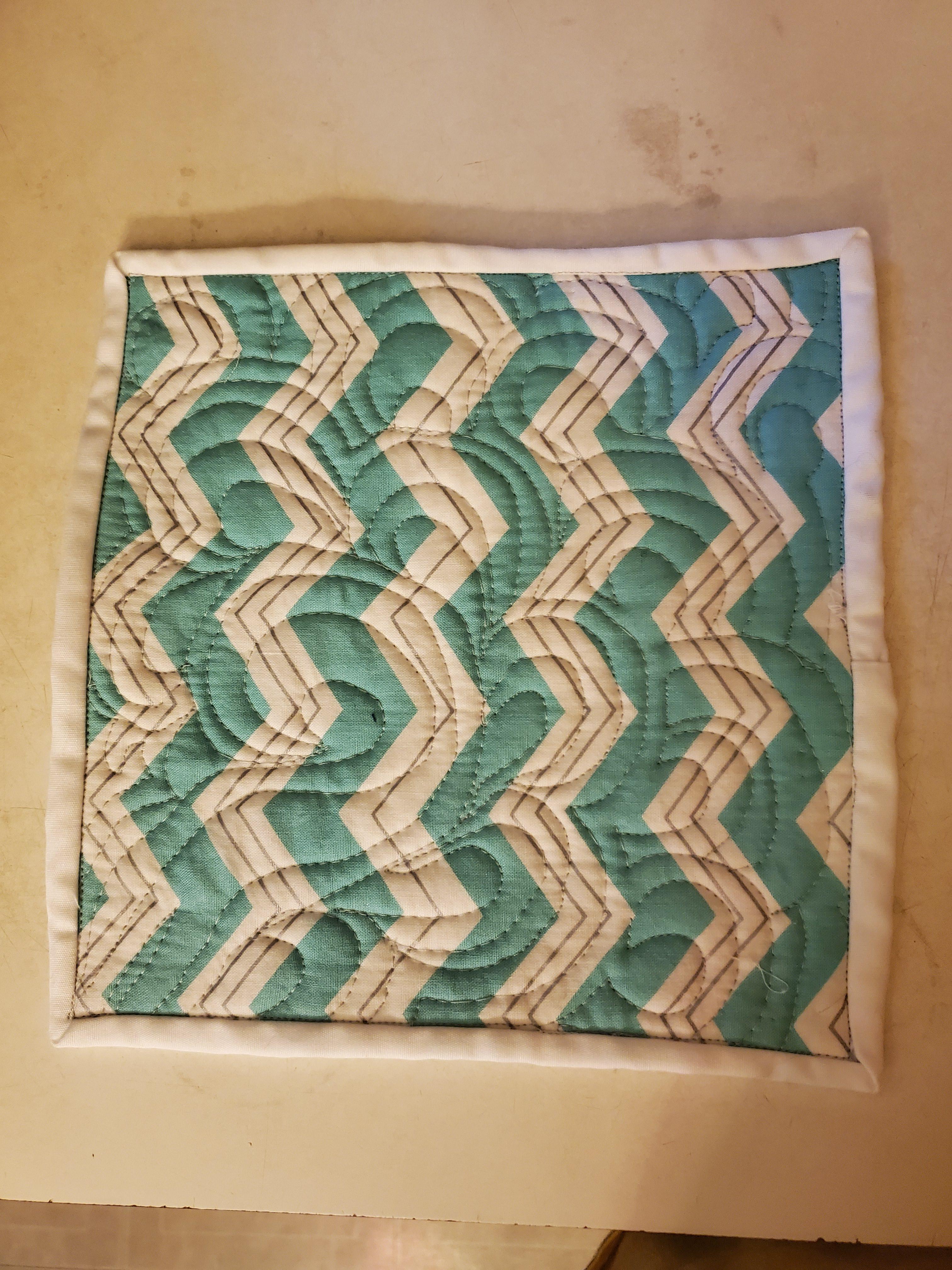 Learning how to FMQ, made this potholder! Very new to quilting